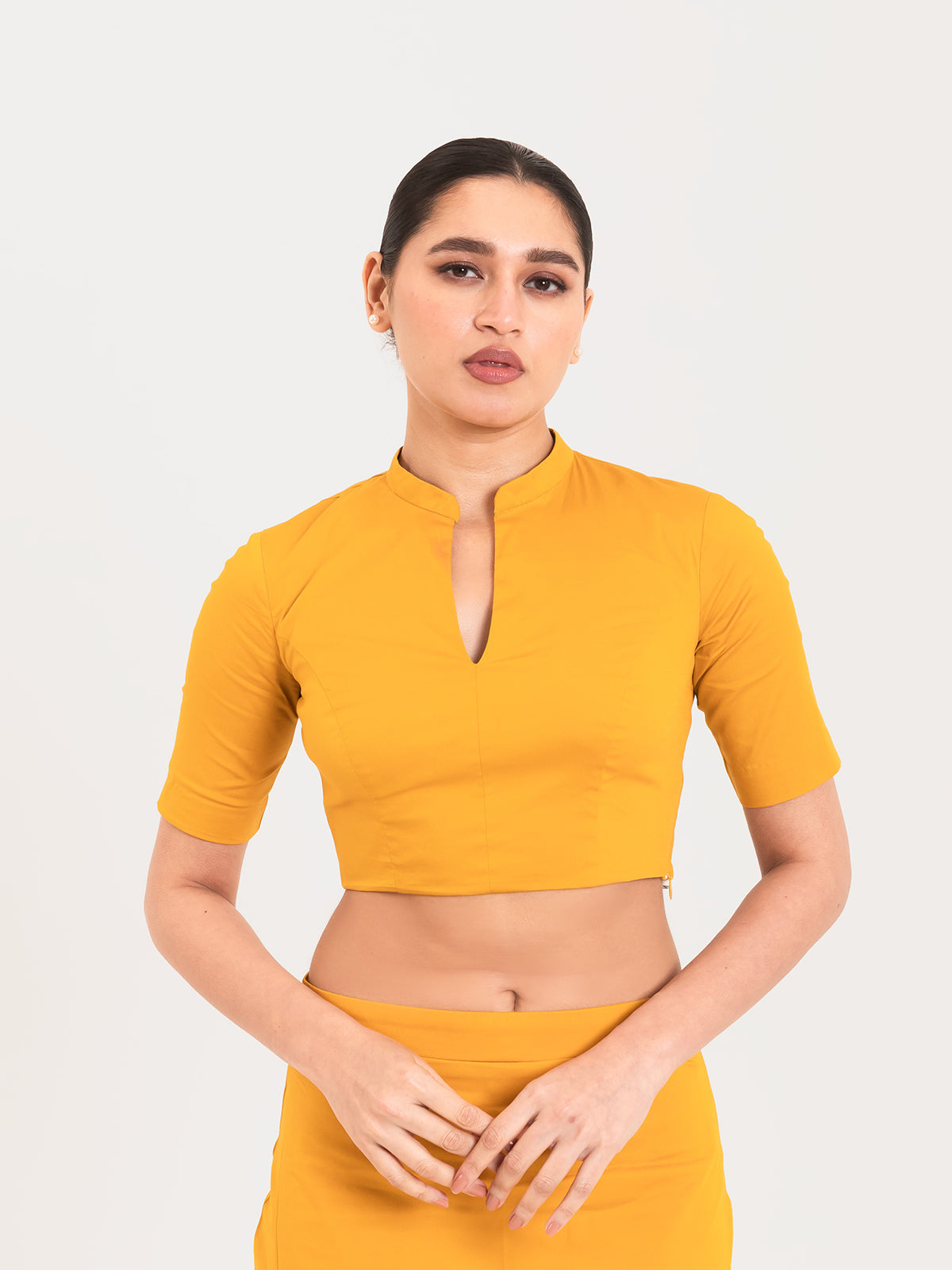 Yellow cotton lycra collar neck sleeveless blouse
