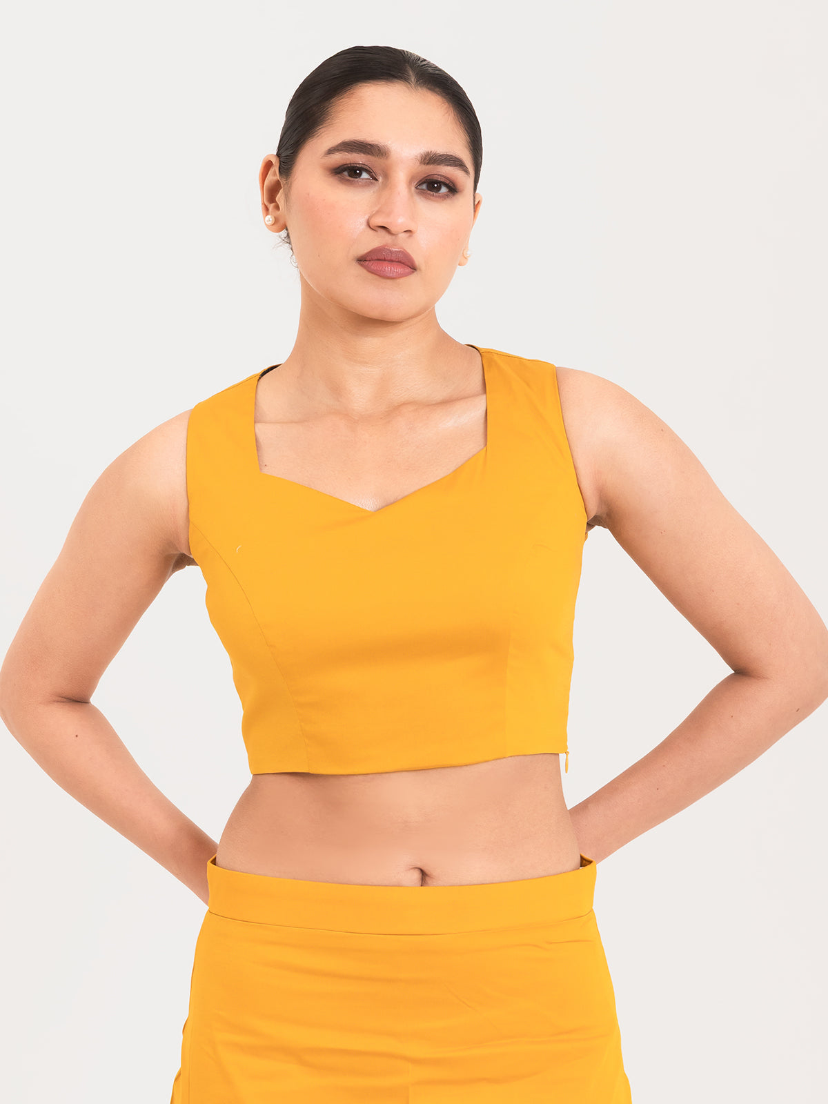 Yellow cotton lycra sweetheart neck sleeveless blouse