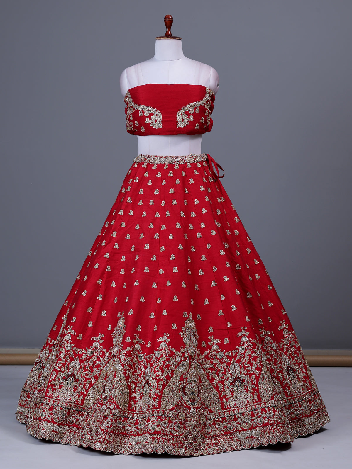 Red raw silk bridal lehenga choli with bird motifs