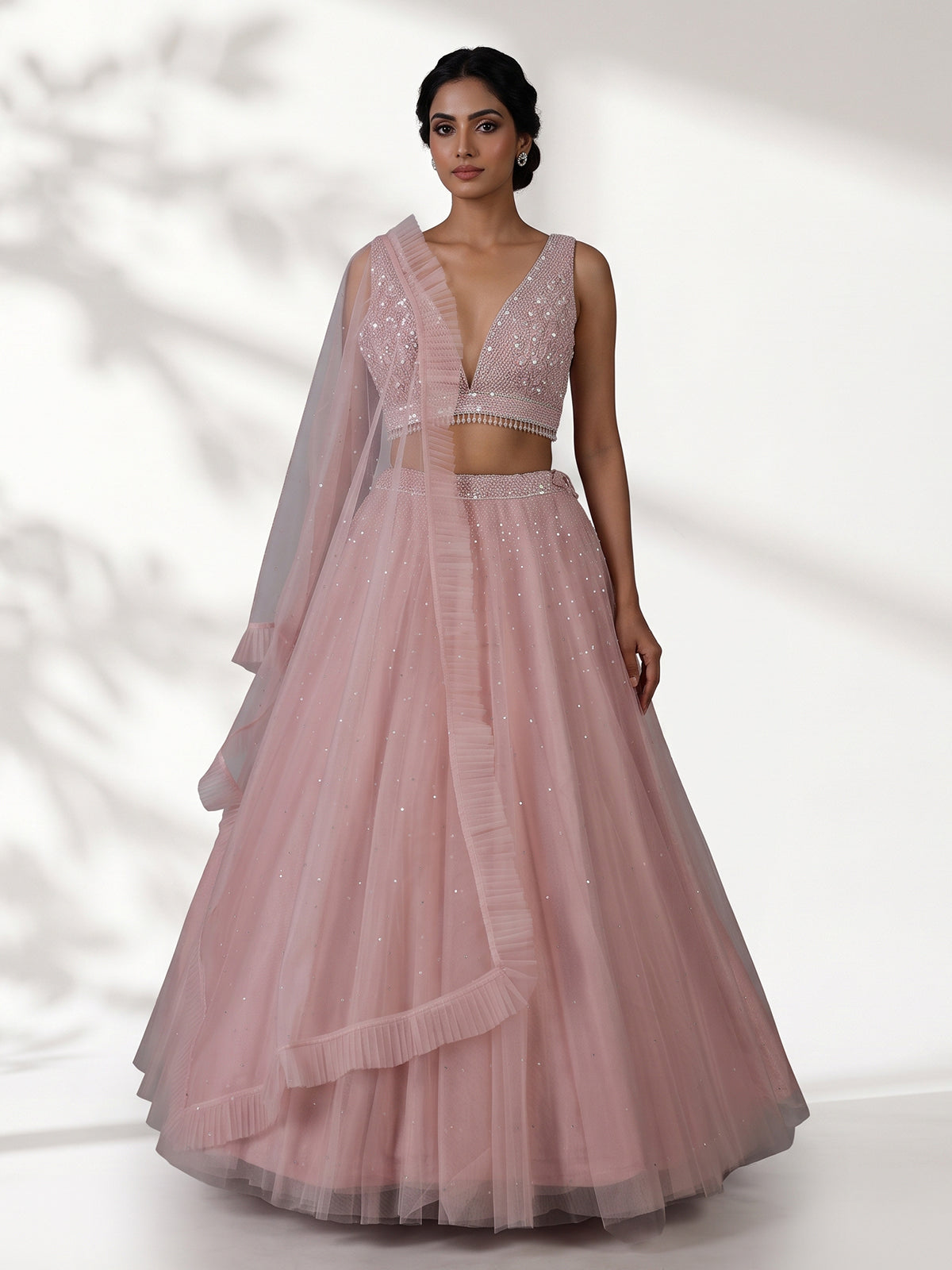 Pink designer net embellished lehenga choli