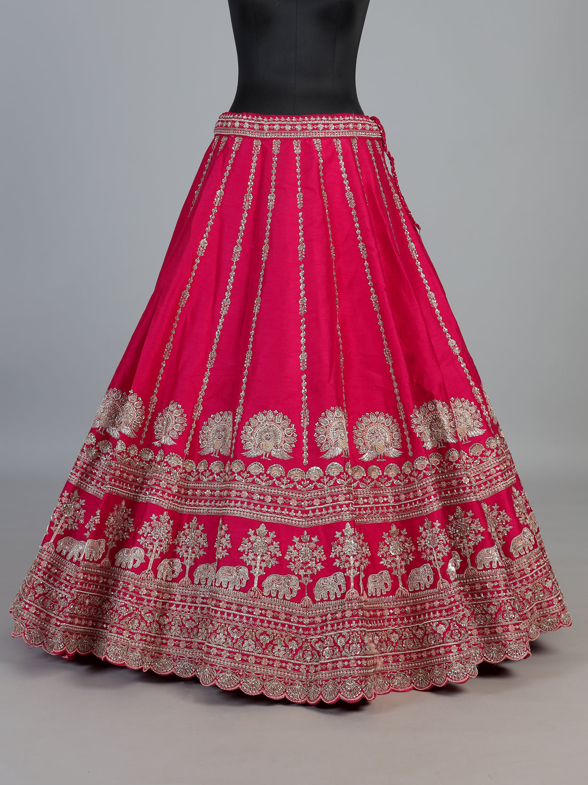 Rani pink bridal raw silk lehenga choli with embellished dupatta