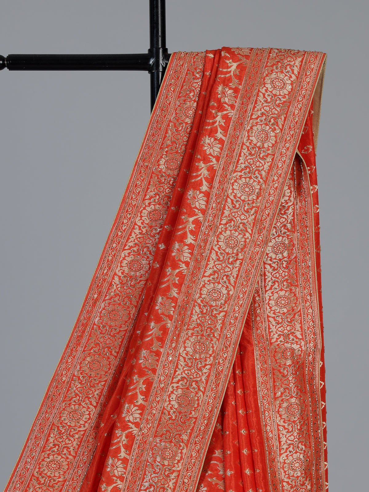 Rust orange premium dola silk saree with elegant zari artistry