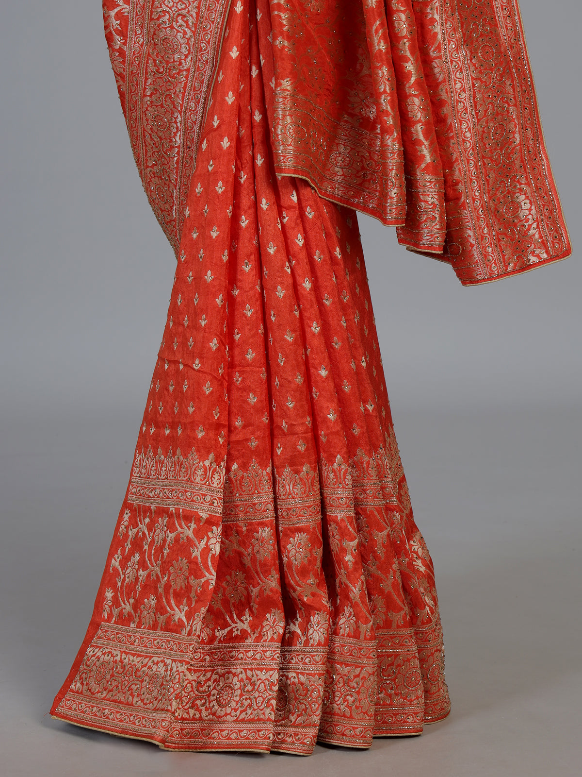Rust orange premium dola silk saree with elegant zari artistry