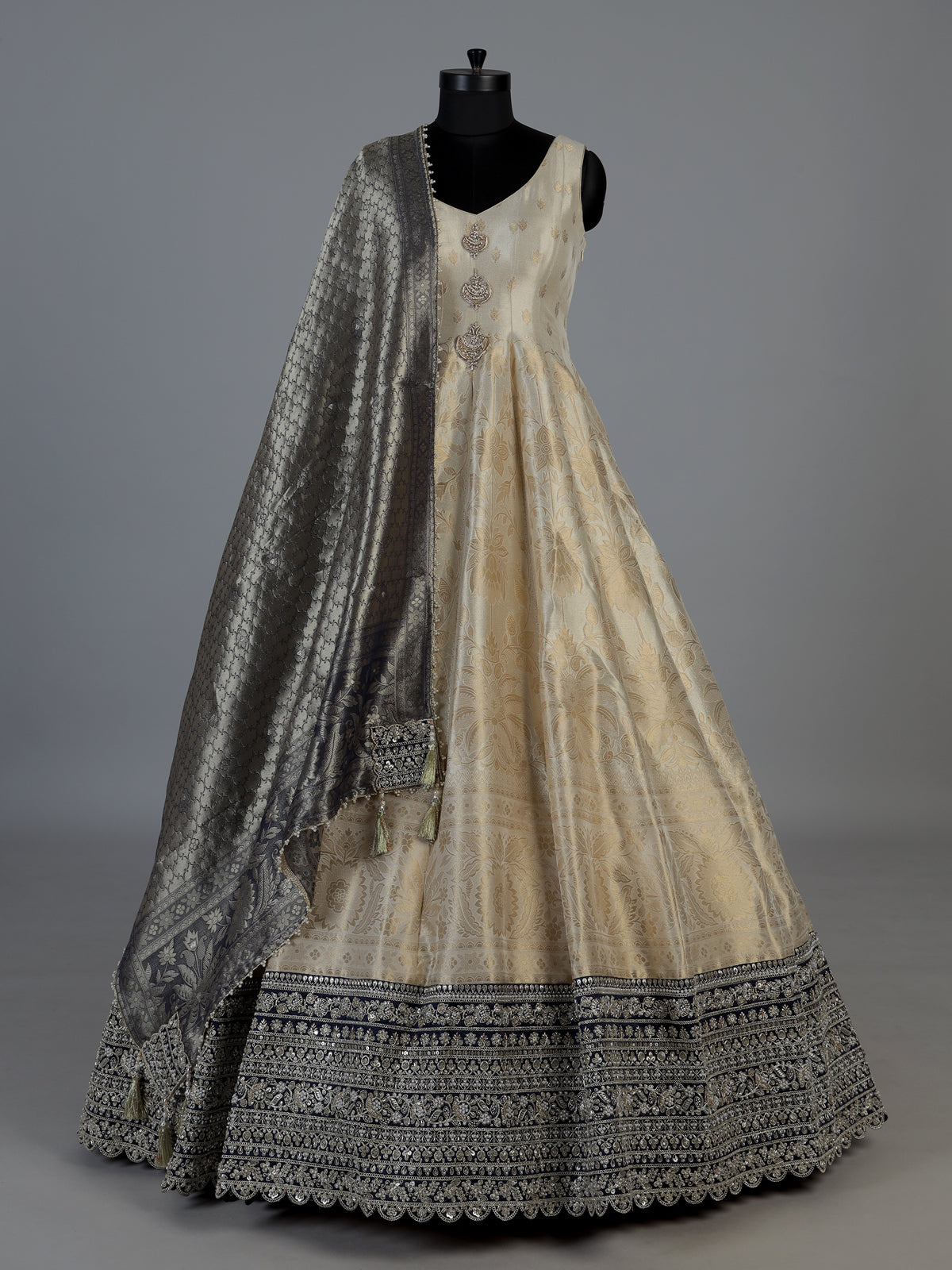 Ivory silk sleeveless anarkali salwar suit with elegant dupatta