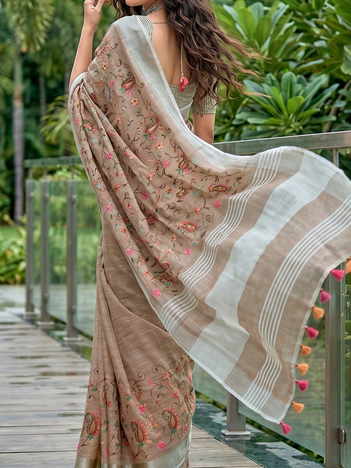 Brown floral kashmiri embroidered linen saree with elegant tassels