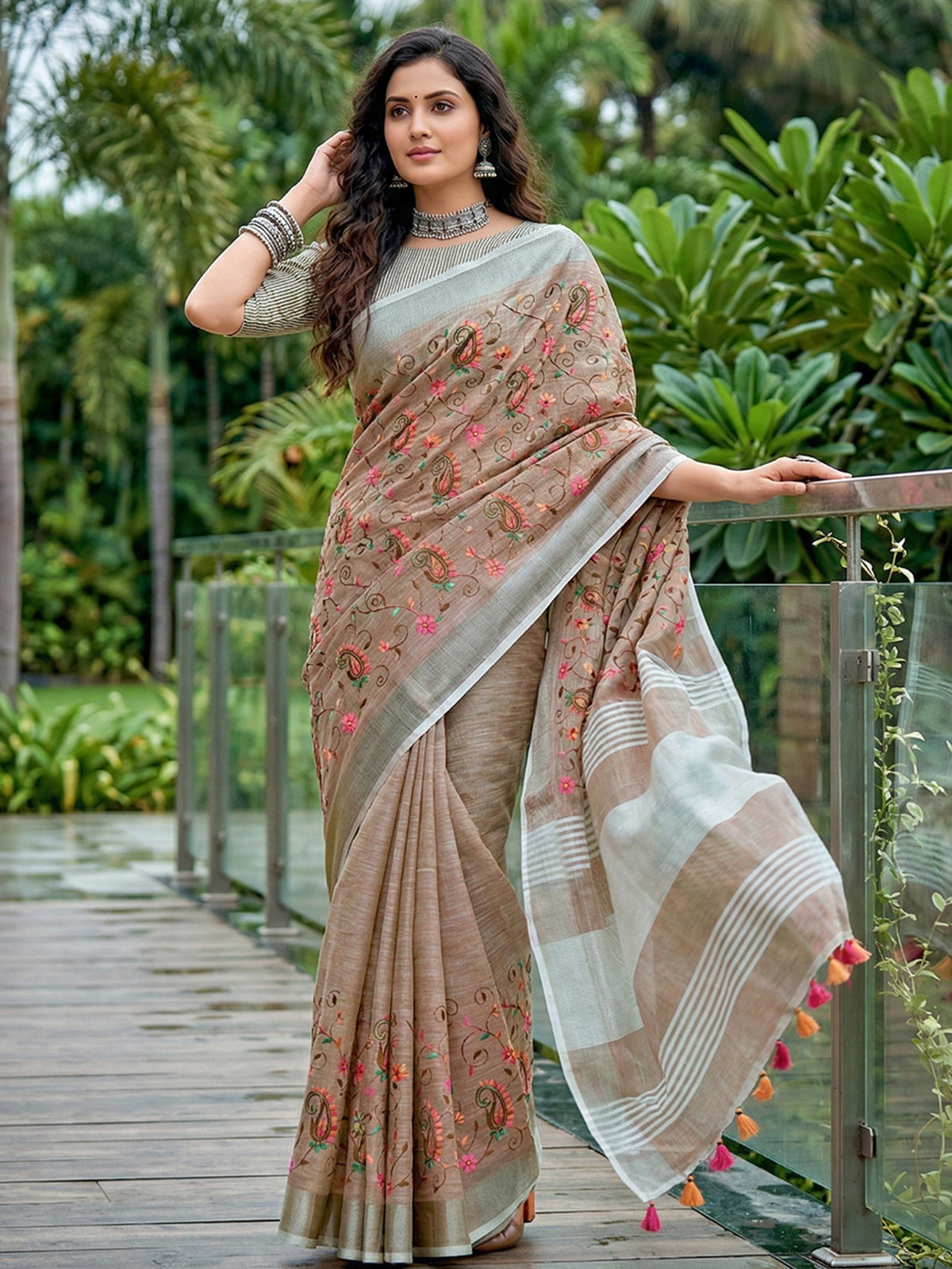 Brown floral kashmiri embroidered linen saree with elegant tassels