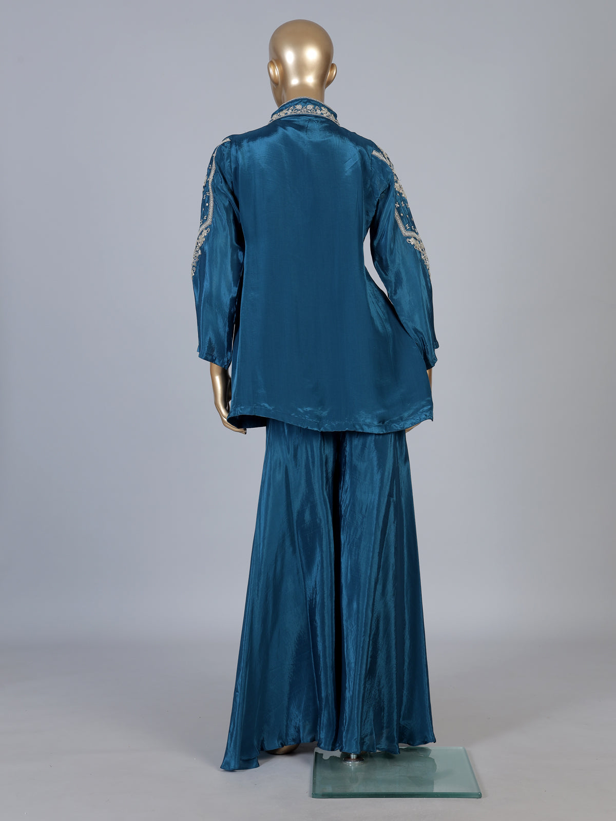 Blue designer silk sharara suit with contemporary asymmetrical style