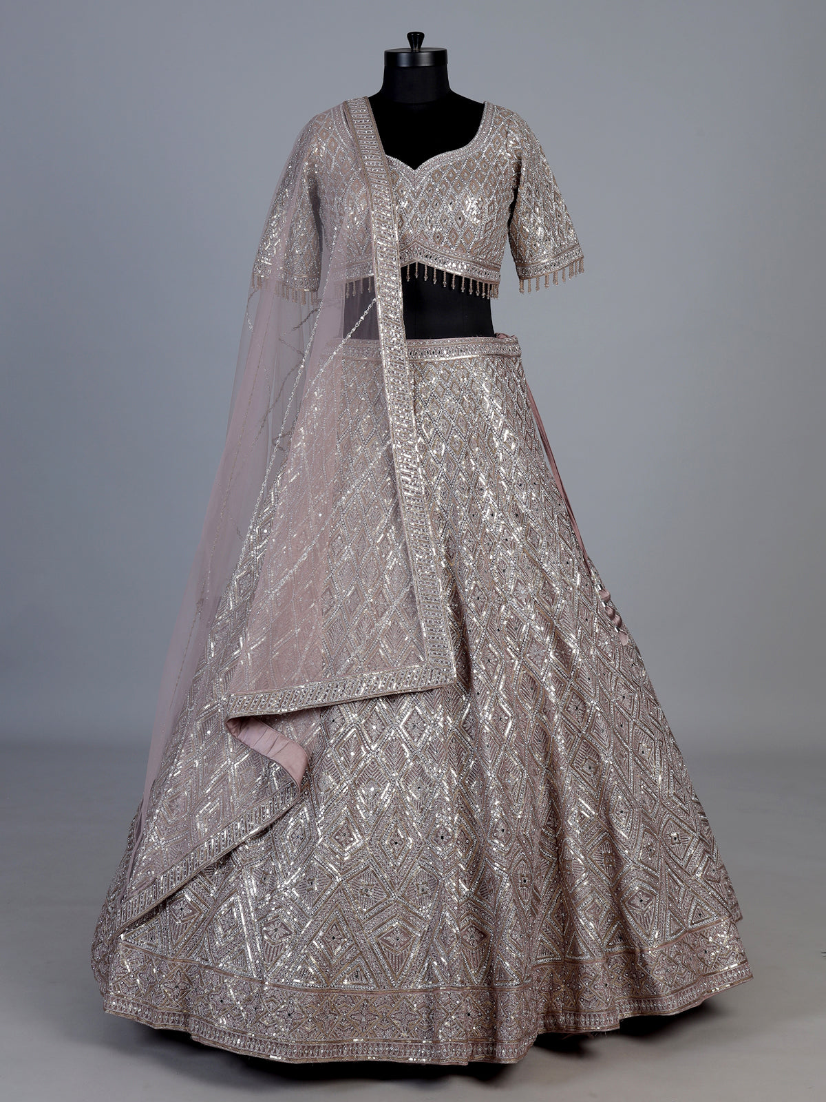 Onion pink embellished net designer lehenga choli