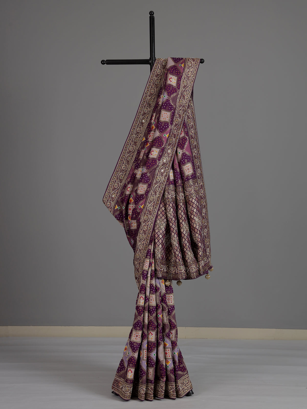 Purple bandhej printed dola silk saree with royal festive charm