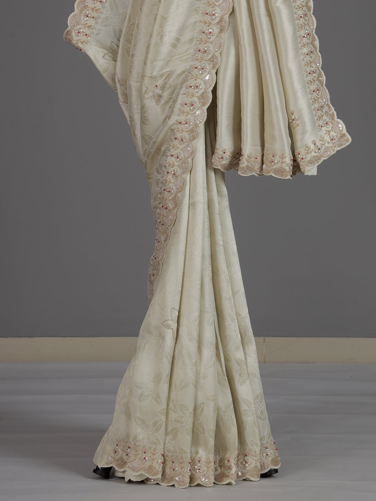 Off white ziraf silk festive saree with premium handcrafted details