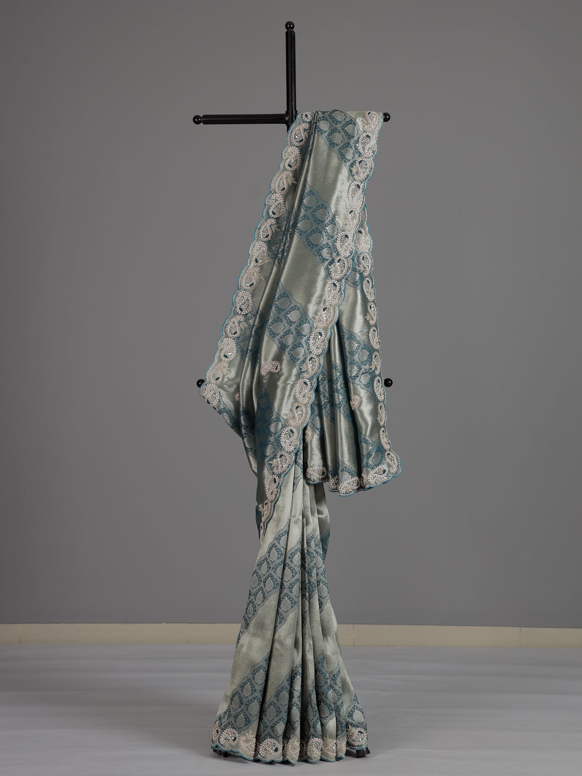 Teal blue tissue silk designer saree with elegant festive work