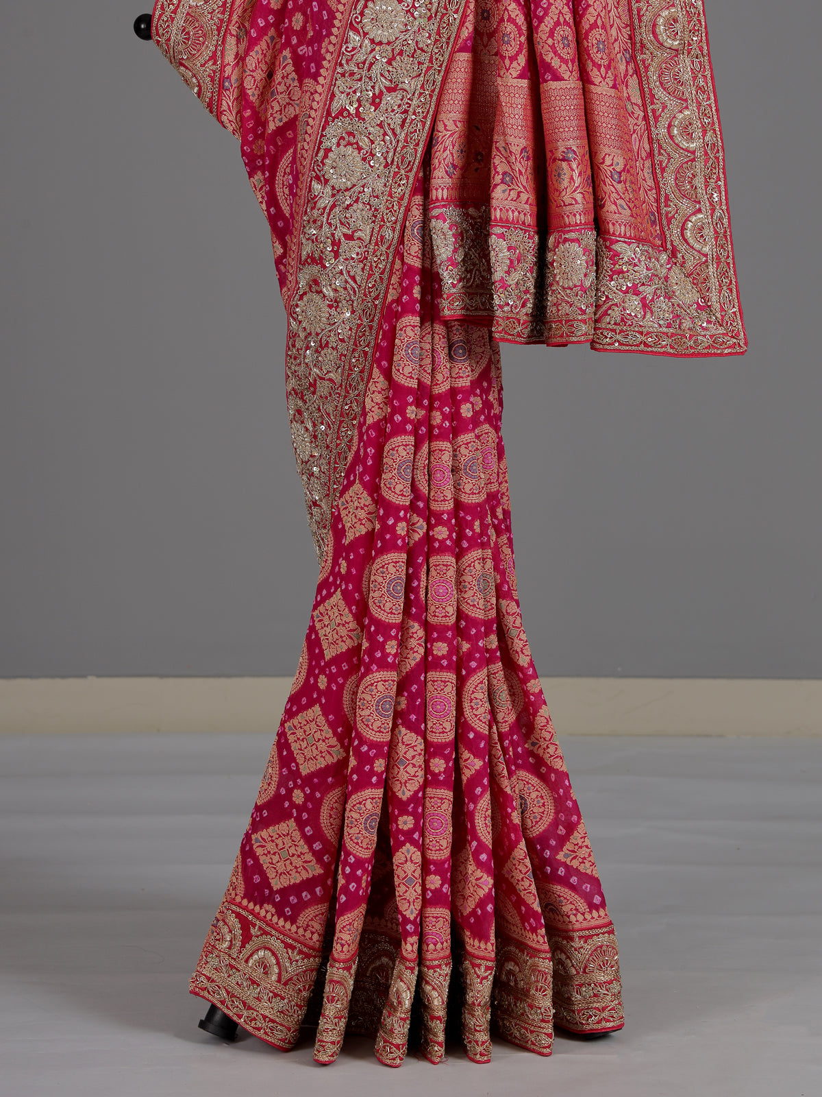 Rani pink bandhani georgette saree with traditional festive elegance