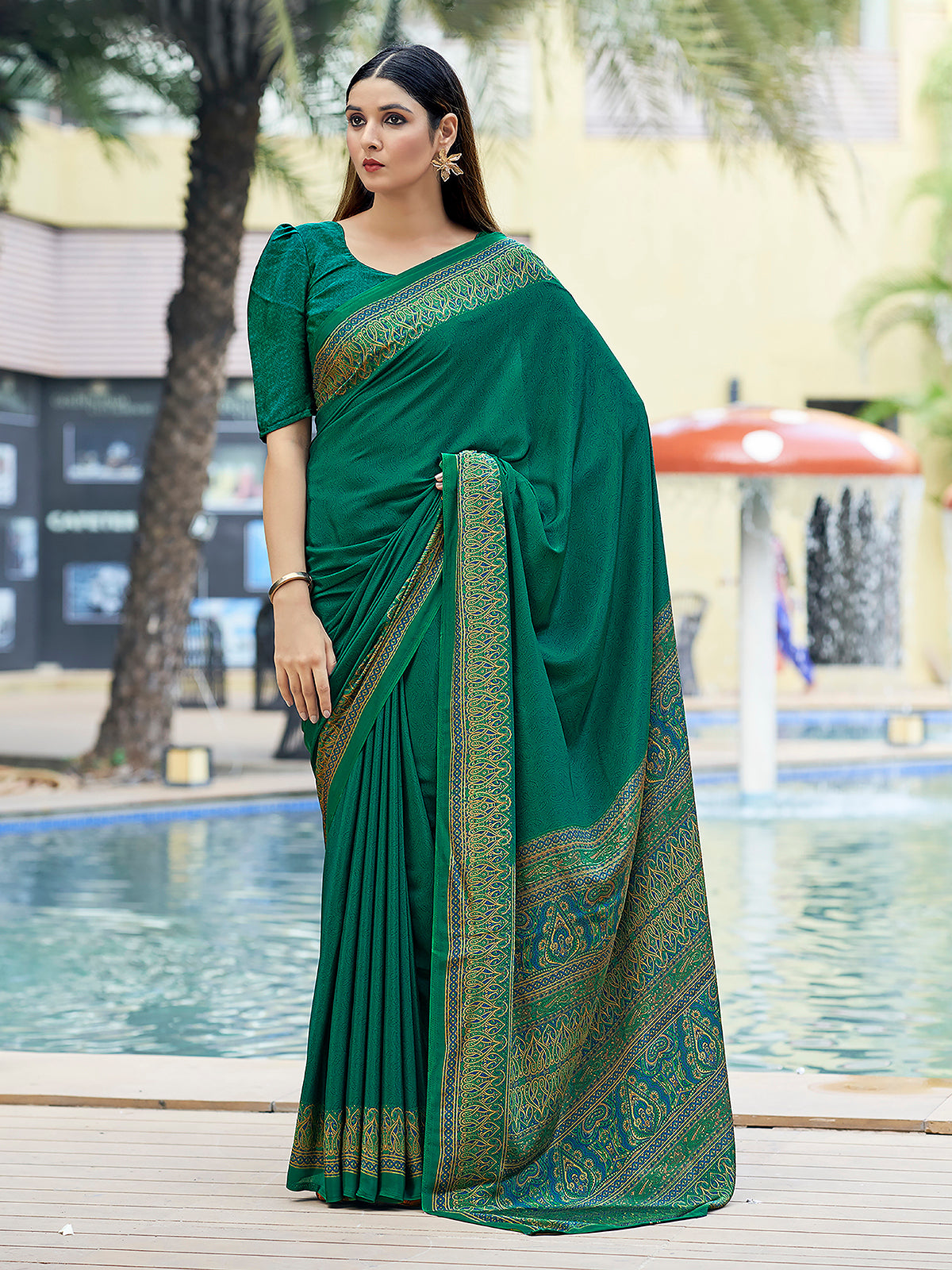 Green printed crepe silk casual saree with contrast border and pallu