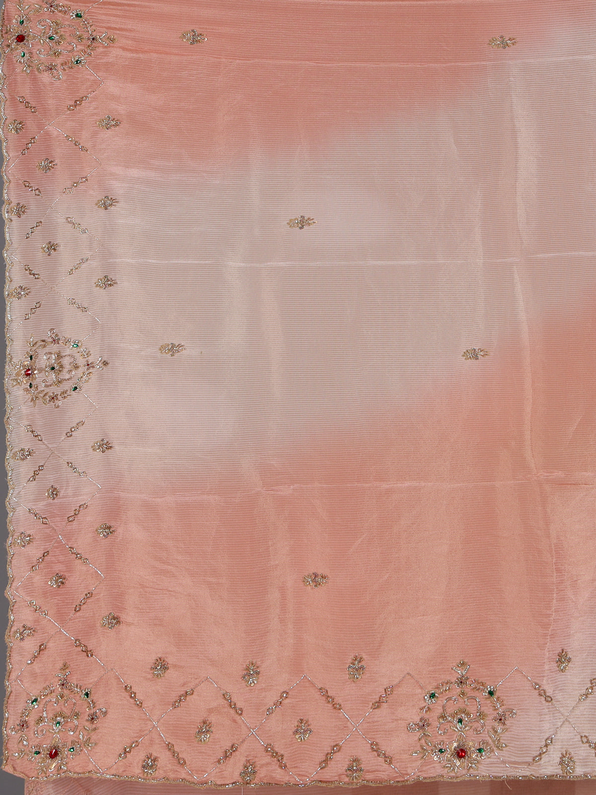 Graceful peach shaded dola shimmer saree for festive occasions