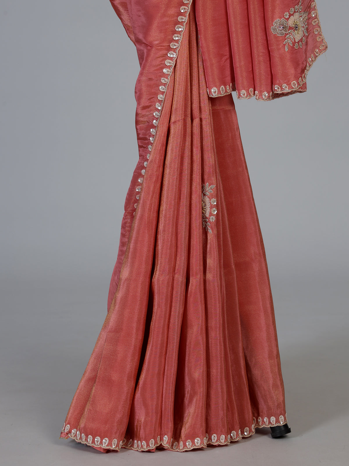 Pastel peach shimmer dola silk designer saree with radiant embellishments