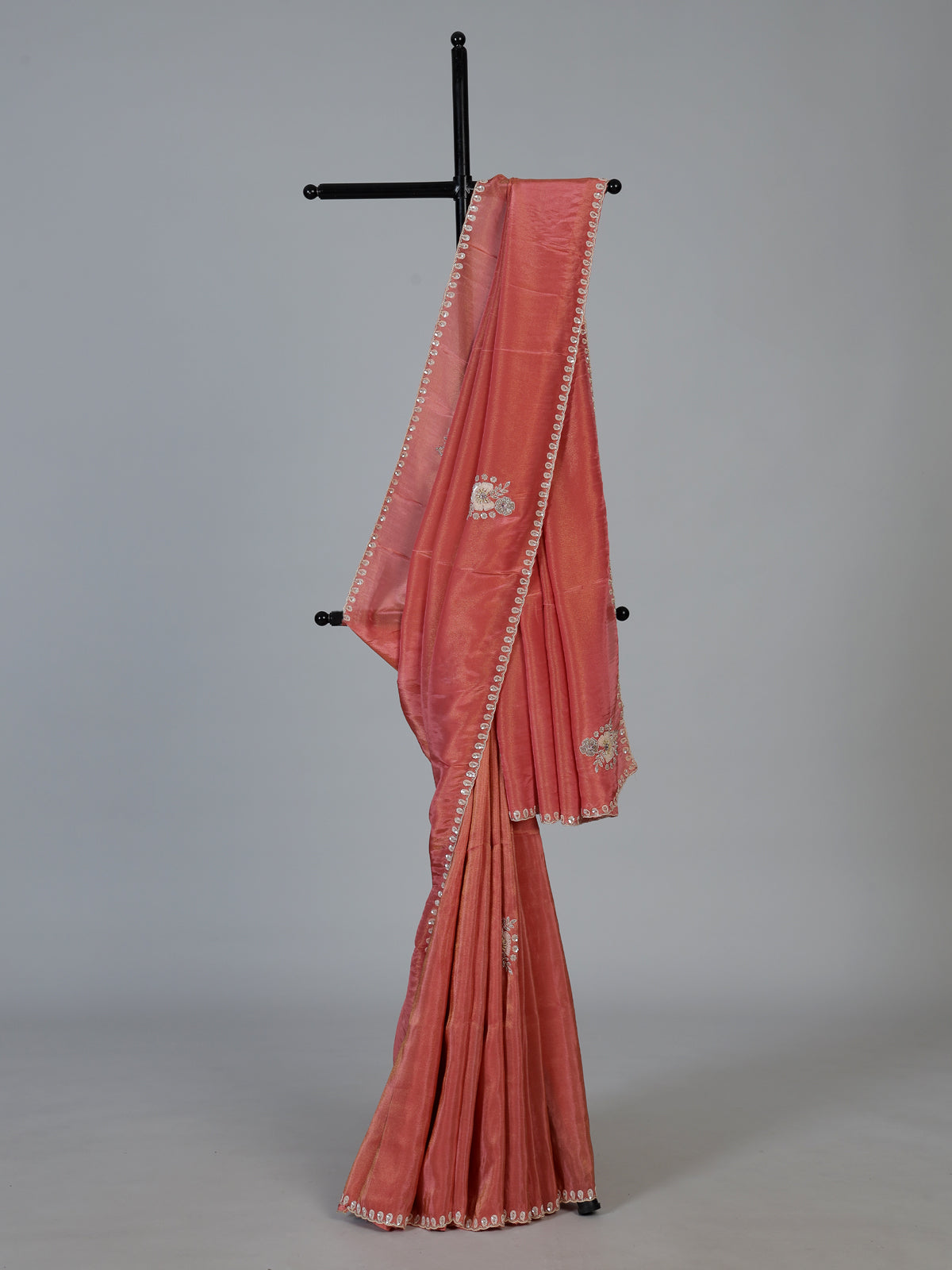 Pastel peach shimmer dola silk designer saree with radiant embellishments