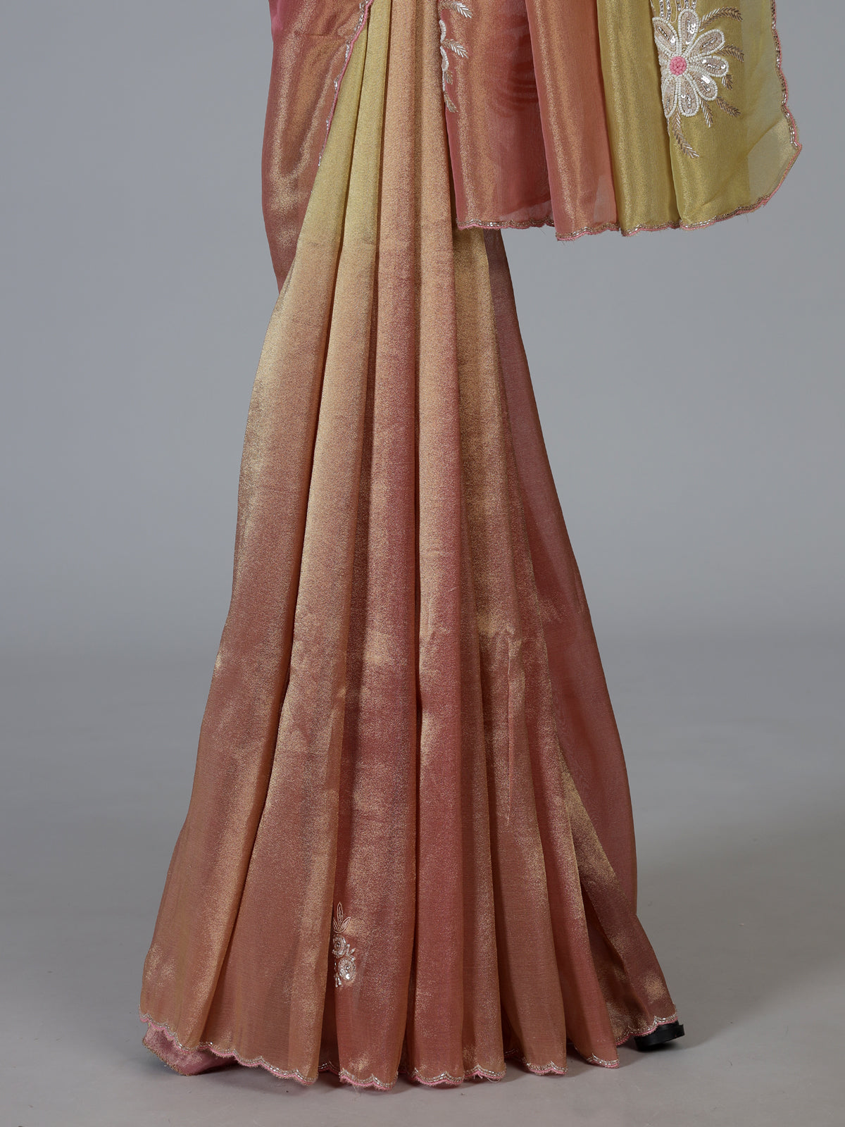 Peach shaded tissue silk designer saree with elegant festive shimmer