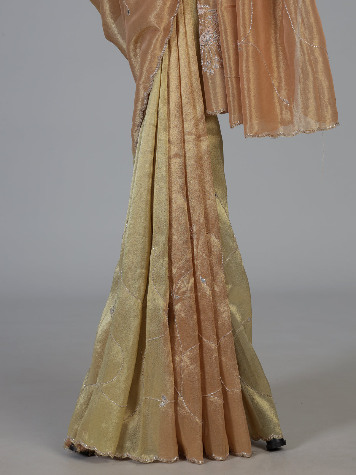 Pastel peach and green tissue silk designer festive saree with elegance