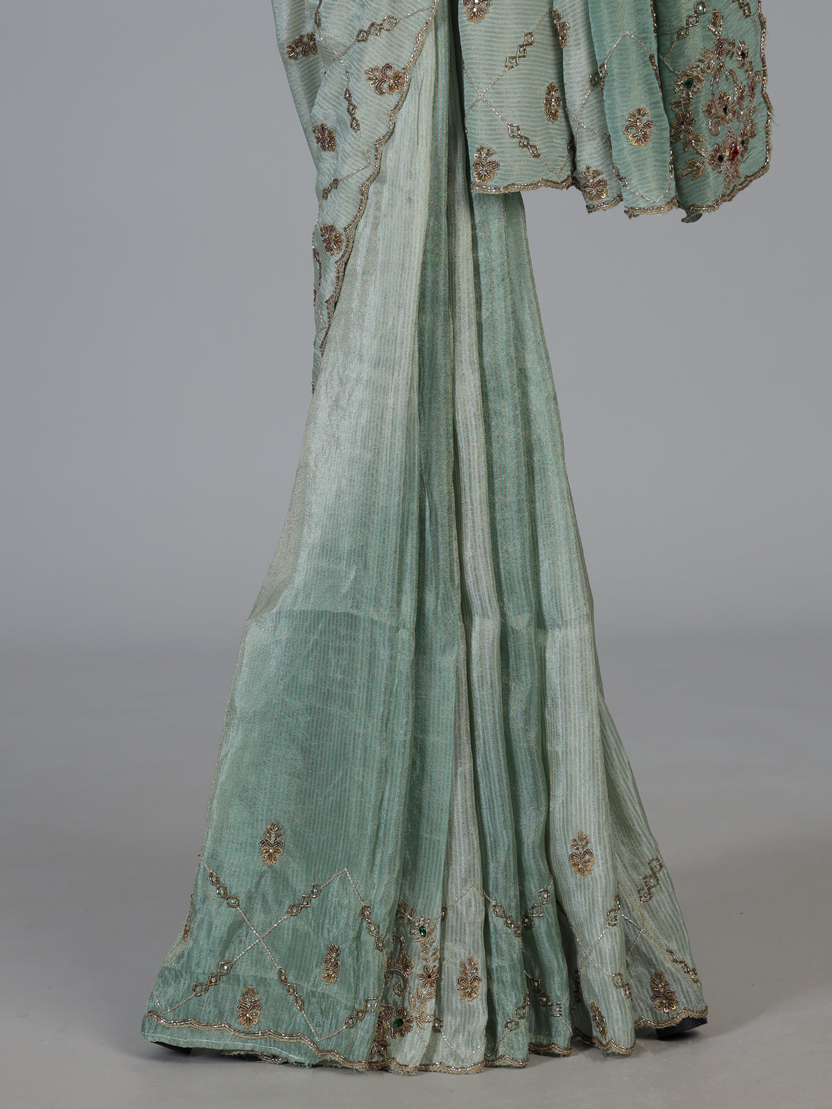 Pista green shimmer dola silk saree with elegant festive embellishments