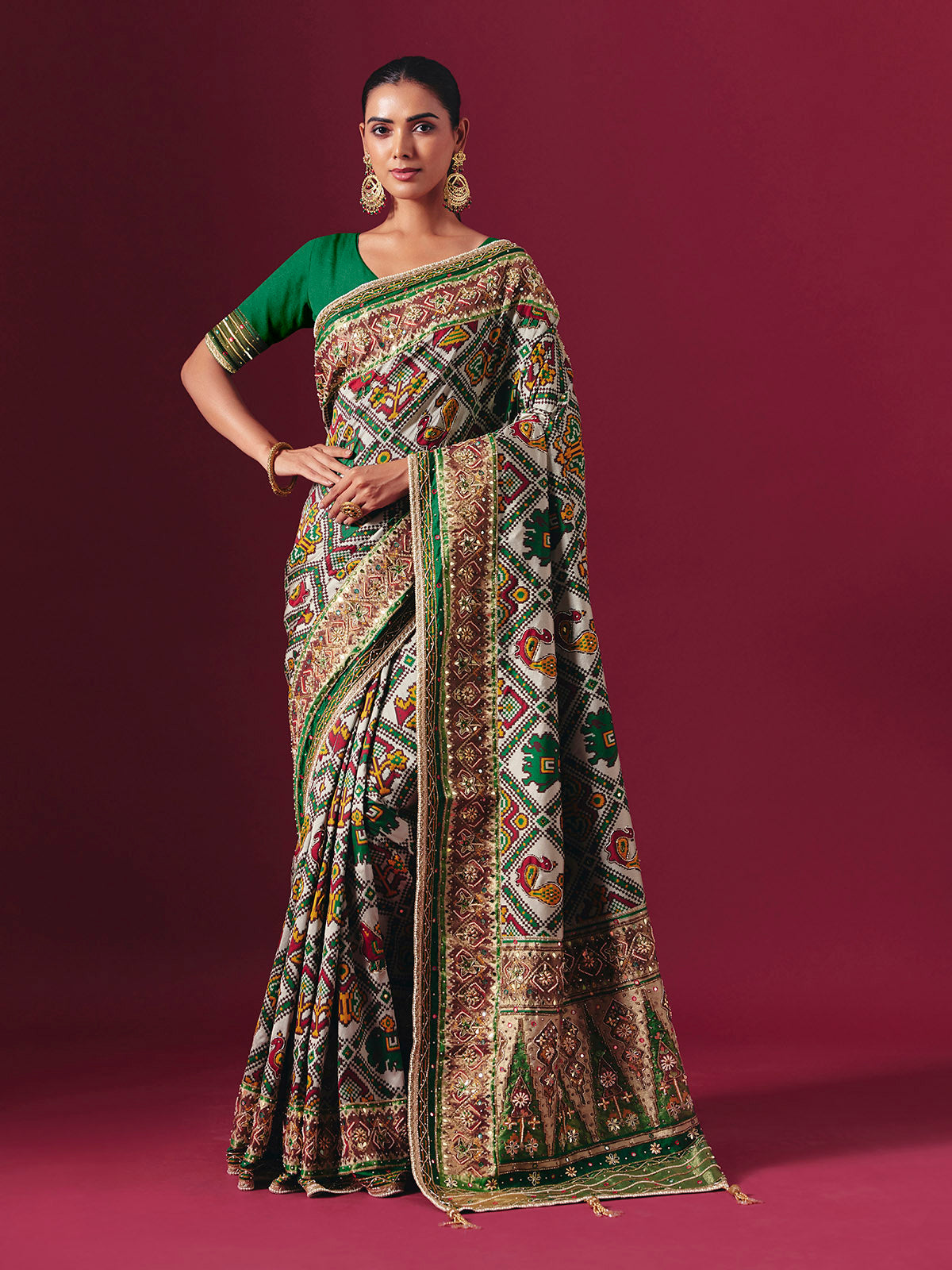 Green art patola silk saree with animal and bird motif artistry