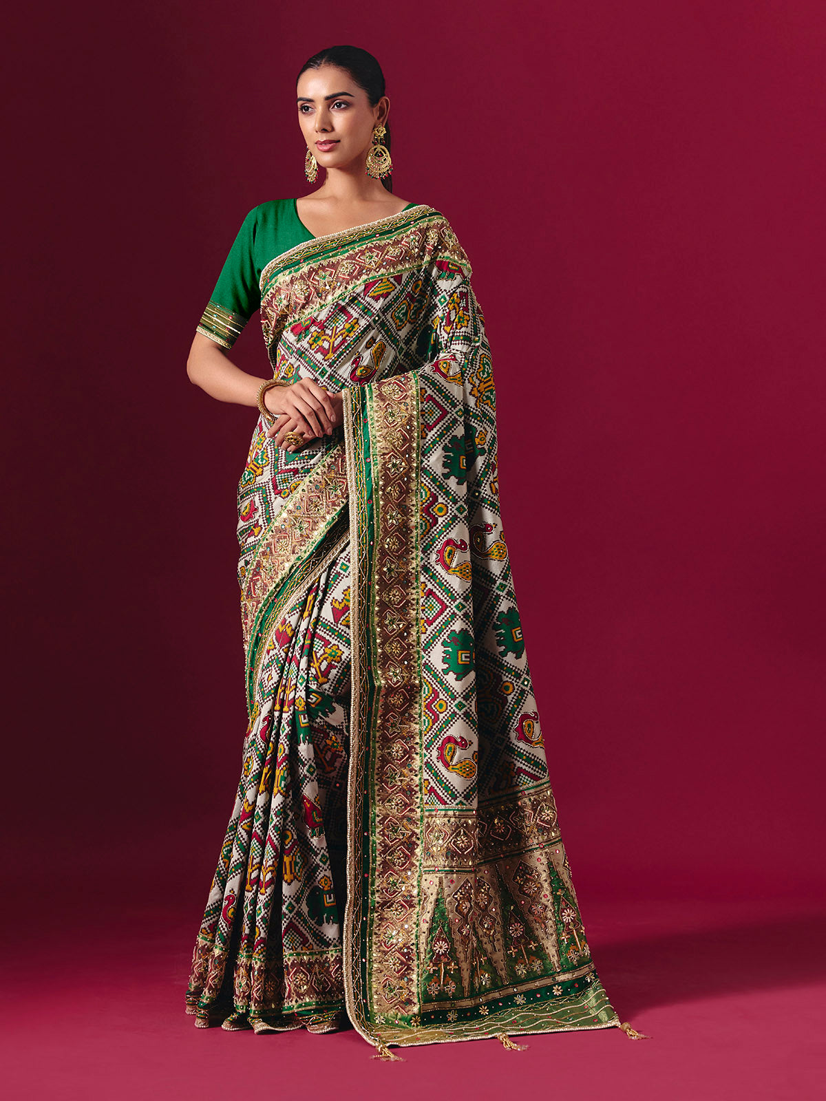 Green art patola silk saree with animal and bird motif artistry