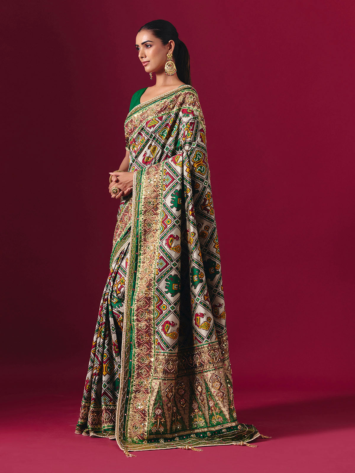 Green art patola silk saree with animal and bird motif artistry