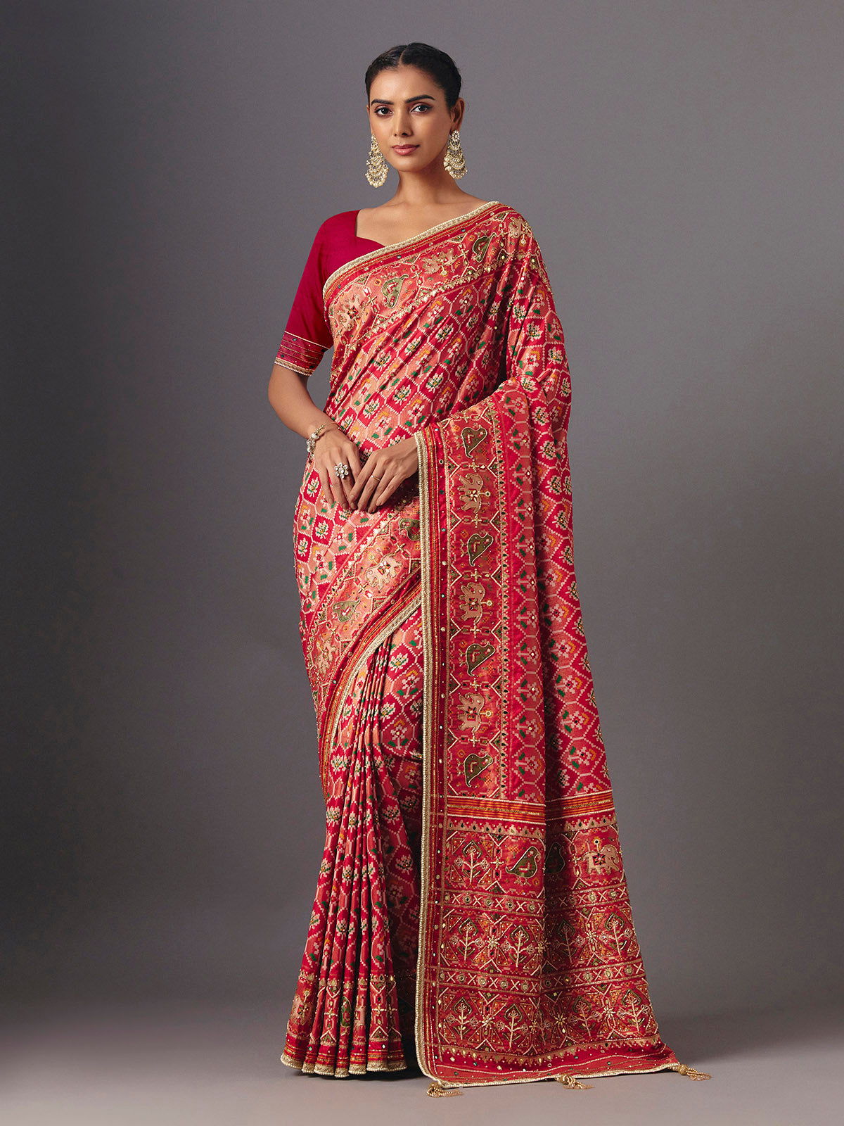 Red art silk patola saree with traditional animal and bird artistry