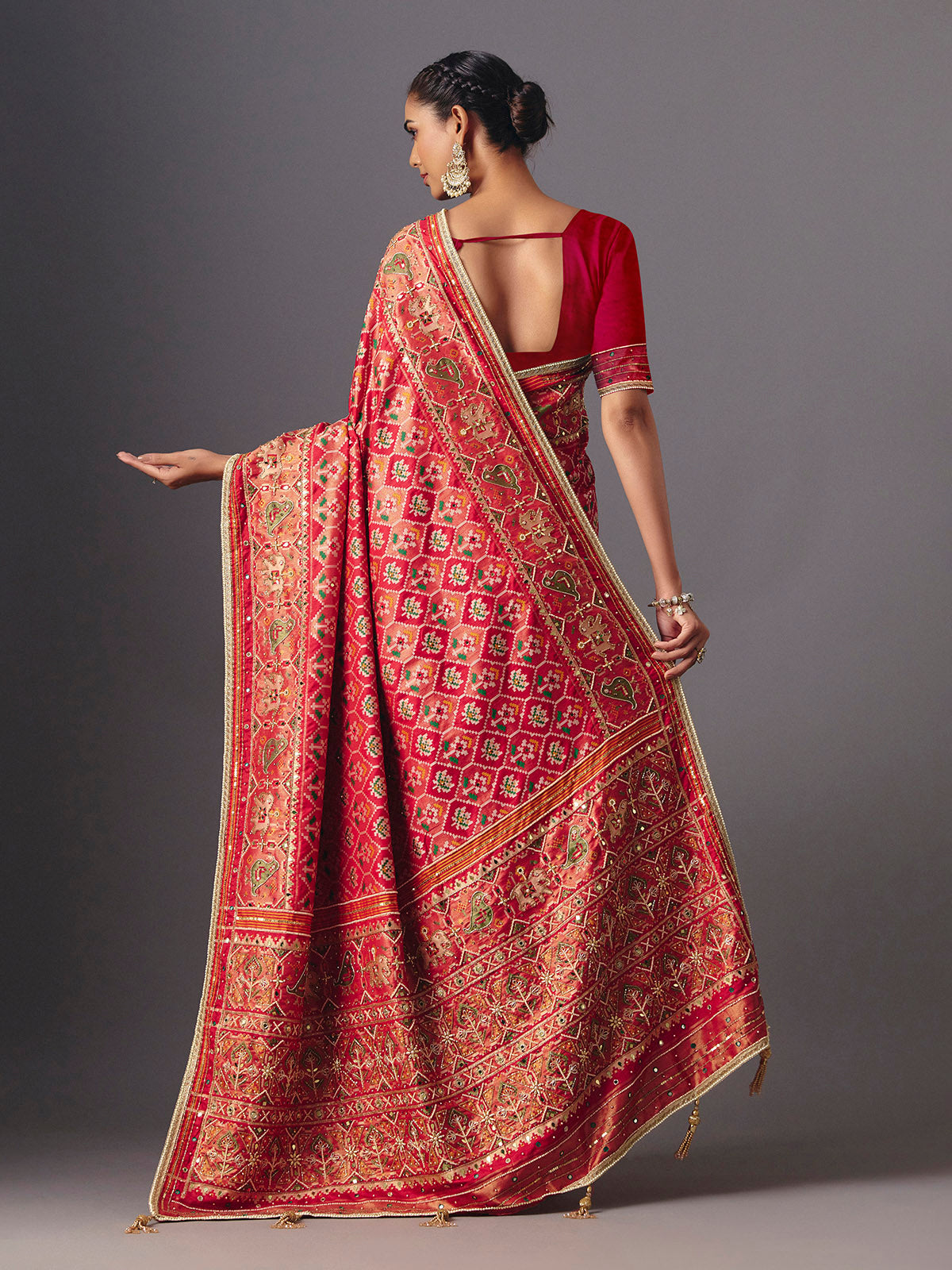 Red art silk patola saree with traditional animal and bird artistry
