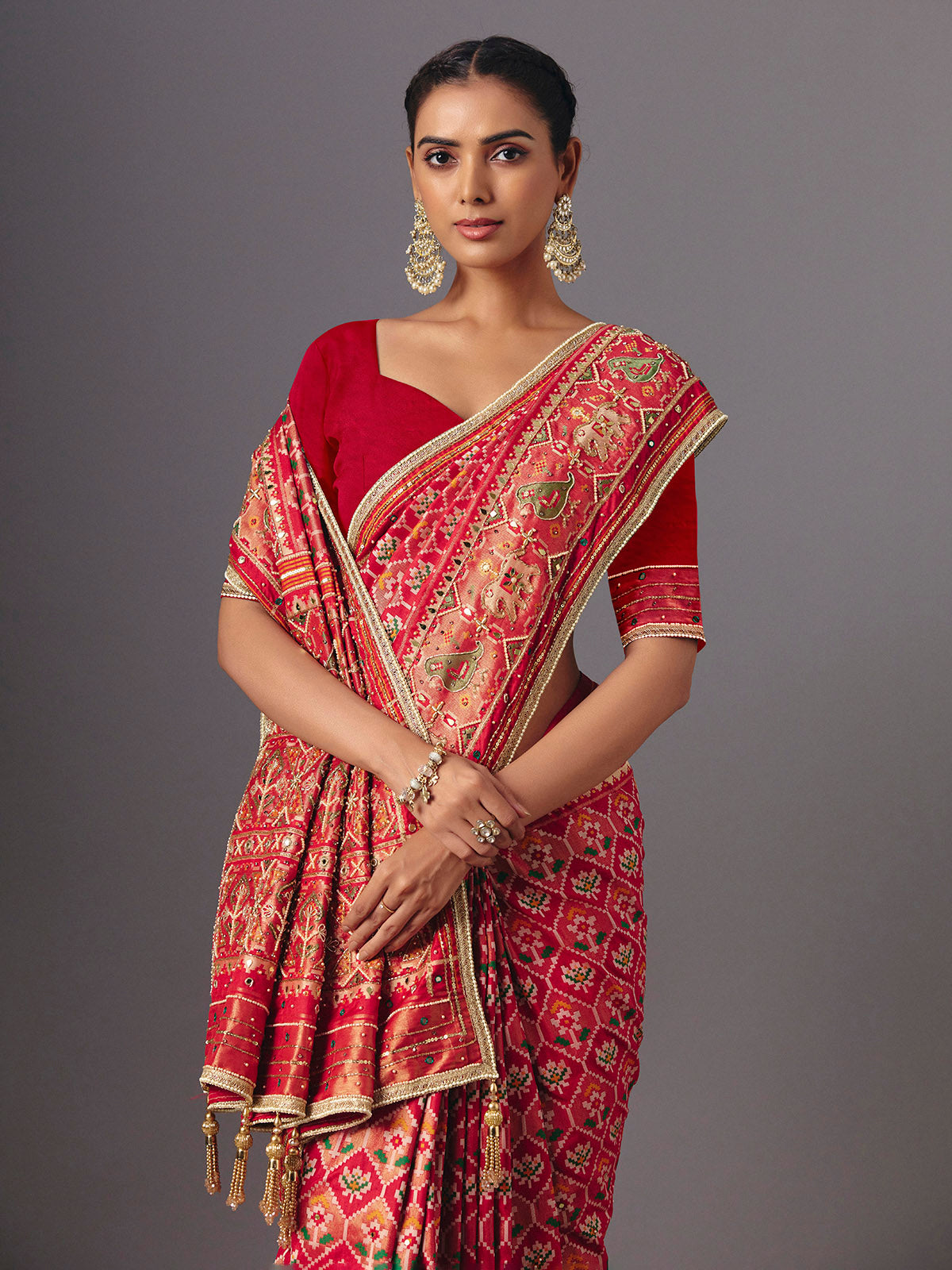 Red art silk patola saree with traditional animal and bird artistry