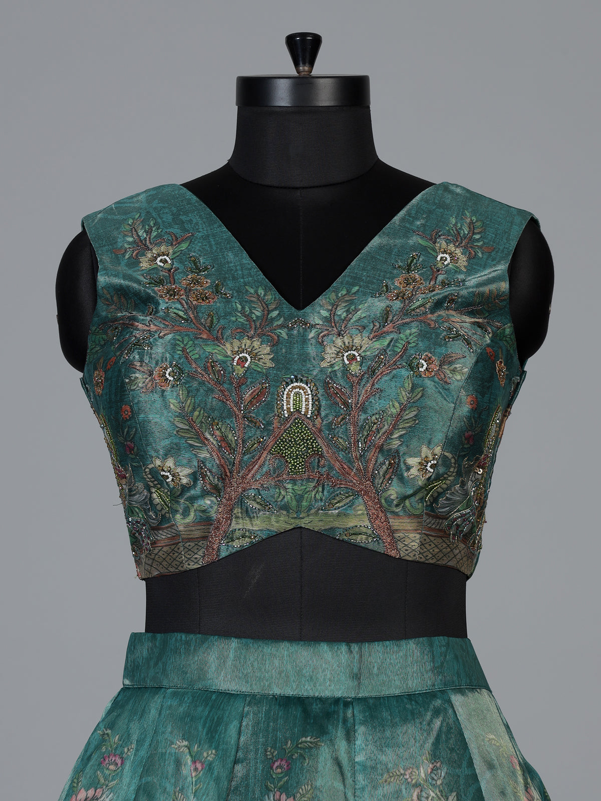 Teal green pichwai printed crepe silk lehenga choli ensemble