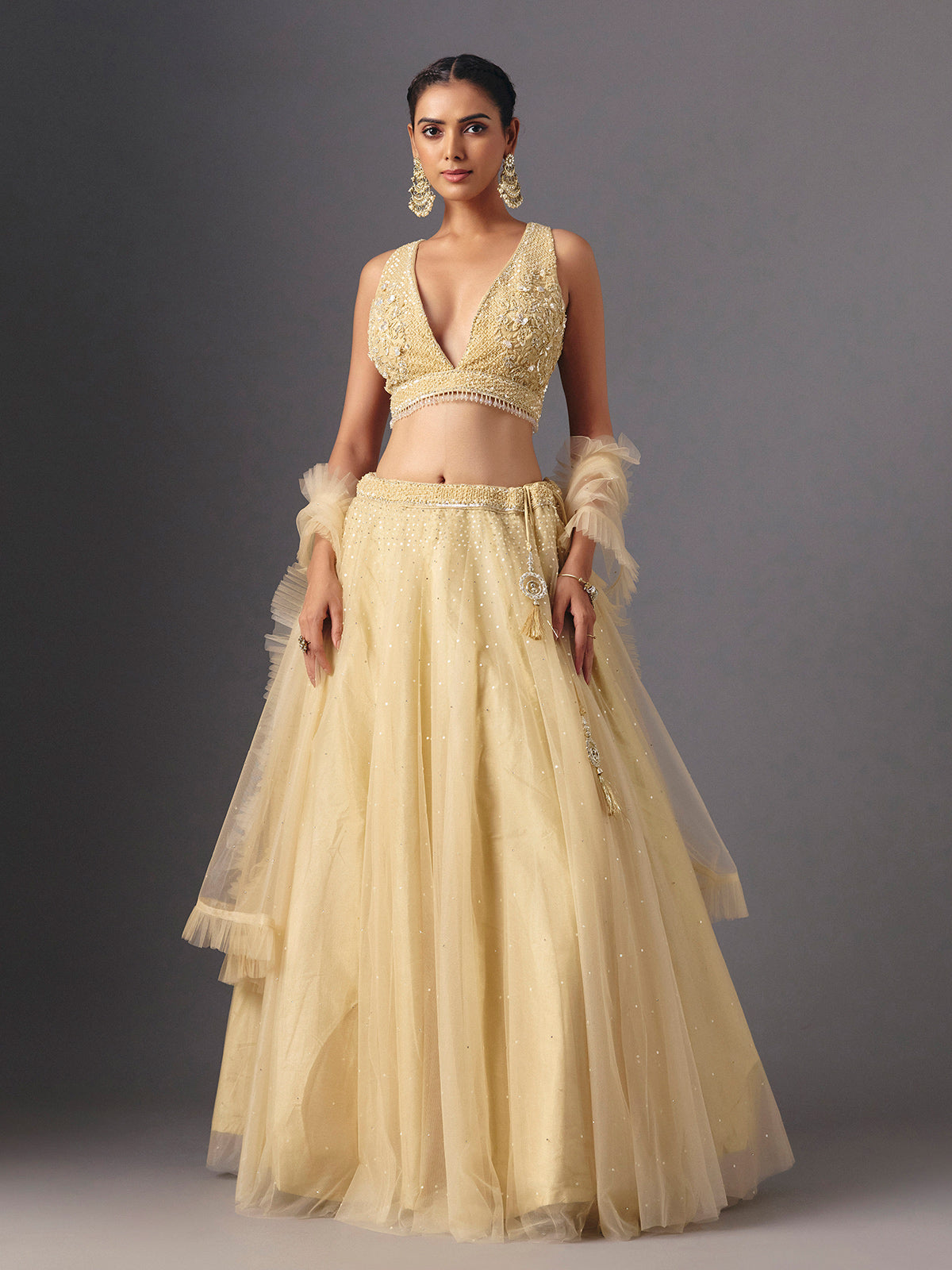 Yellow net designer lehenga choli with elegant dupatta for celebrations