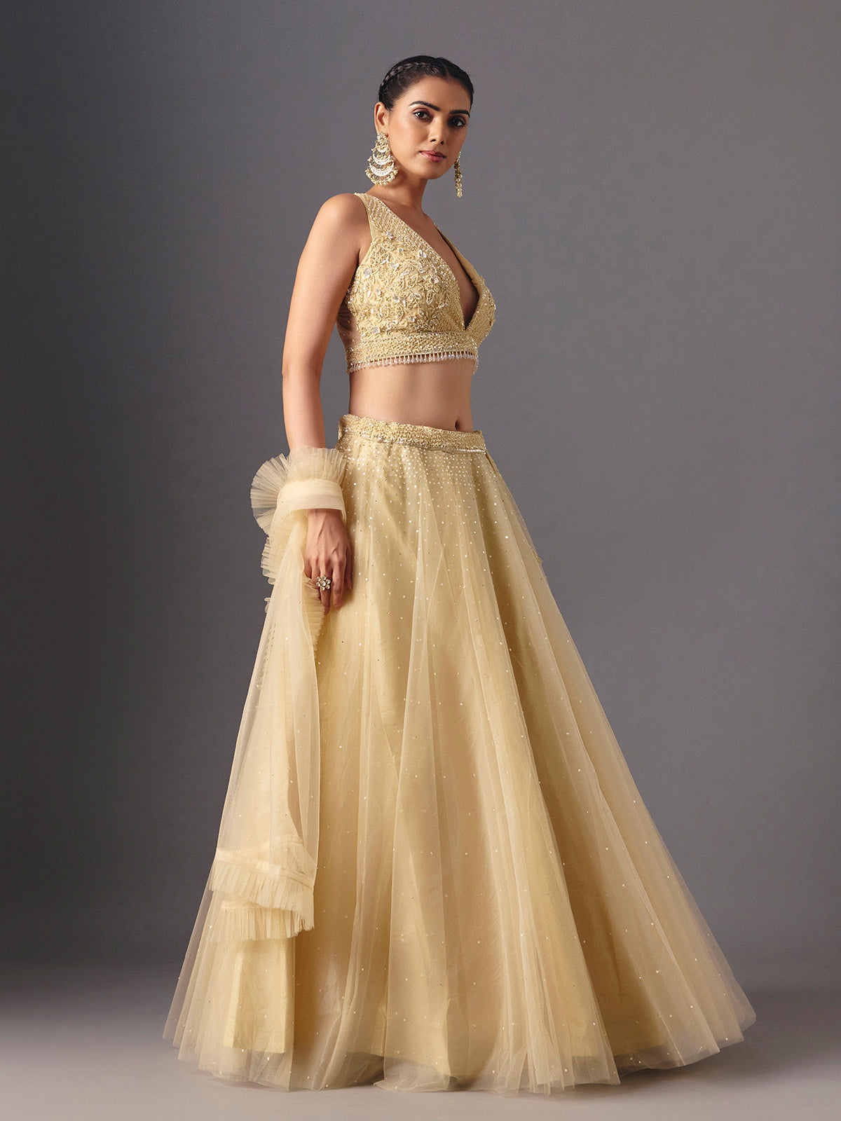 Yellow net designer lehenga choli with elegant dupatta for celebrations