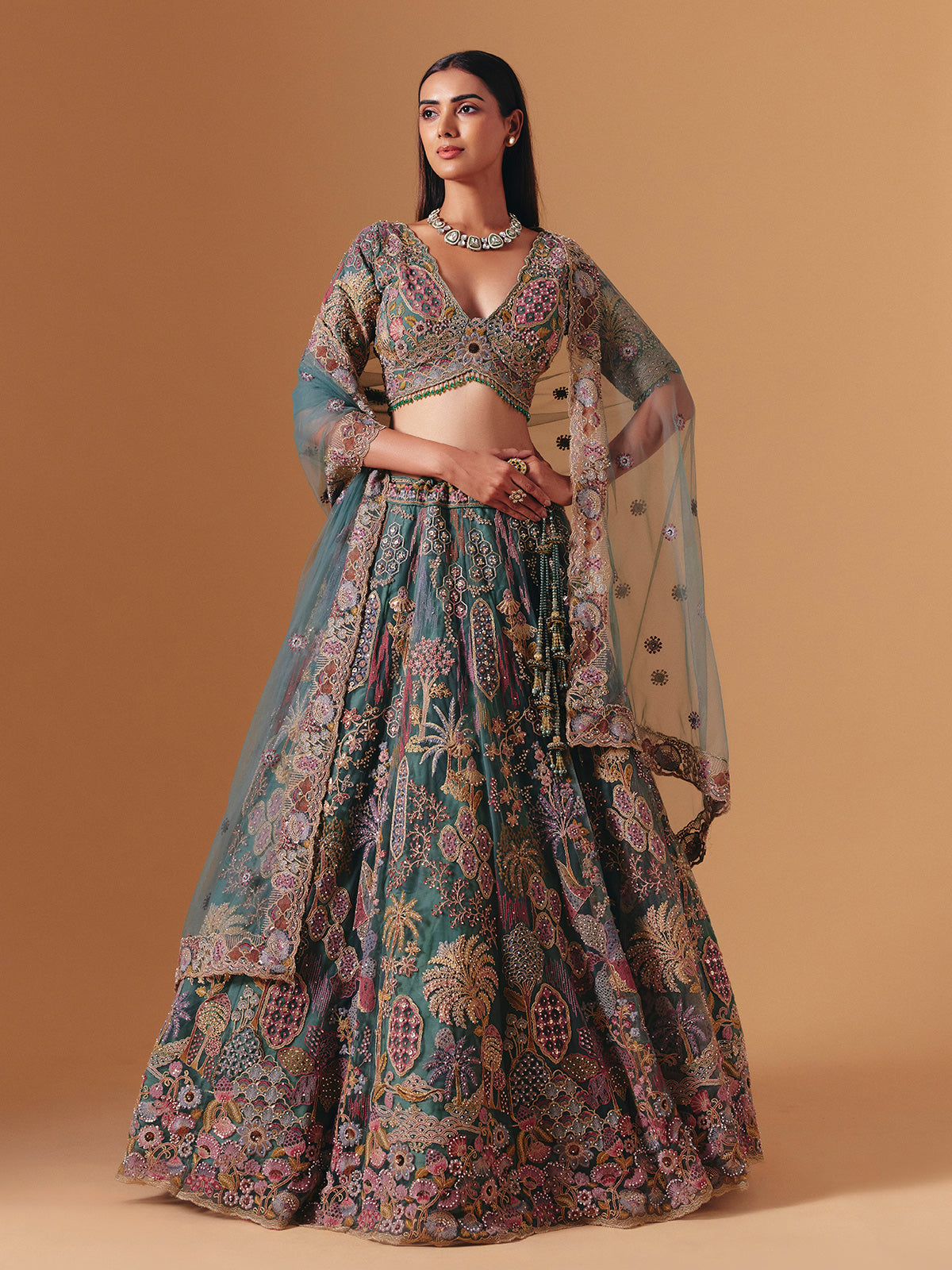 Teal green net designer lehenga choli with elegant dupatta grace