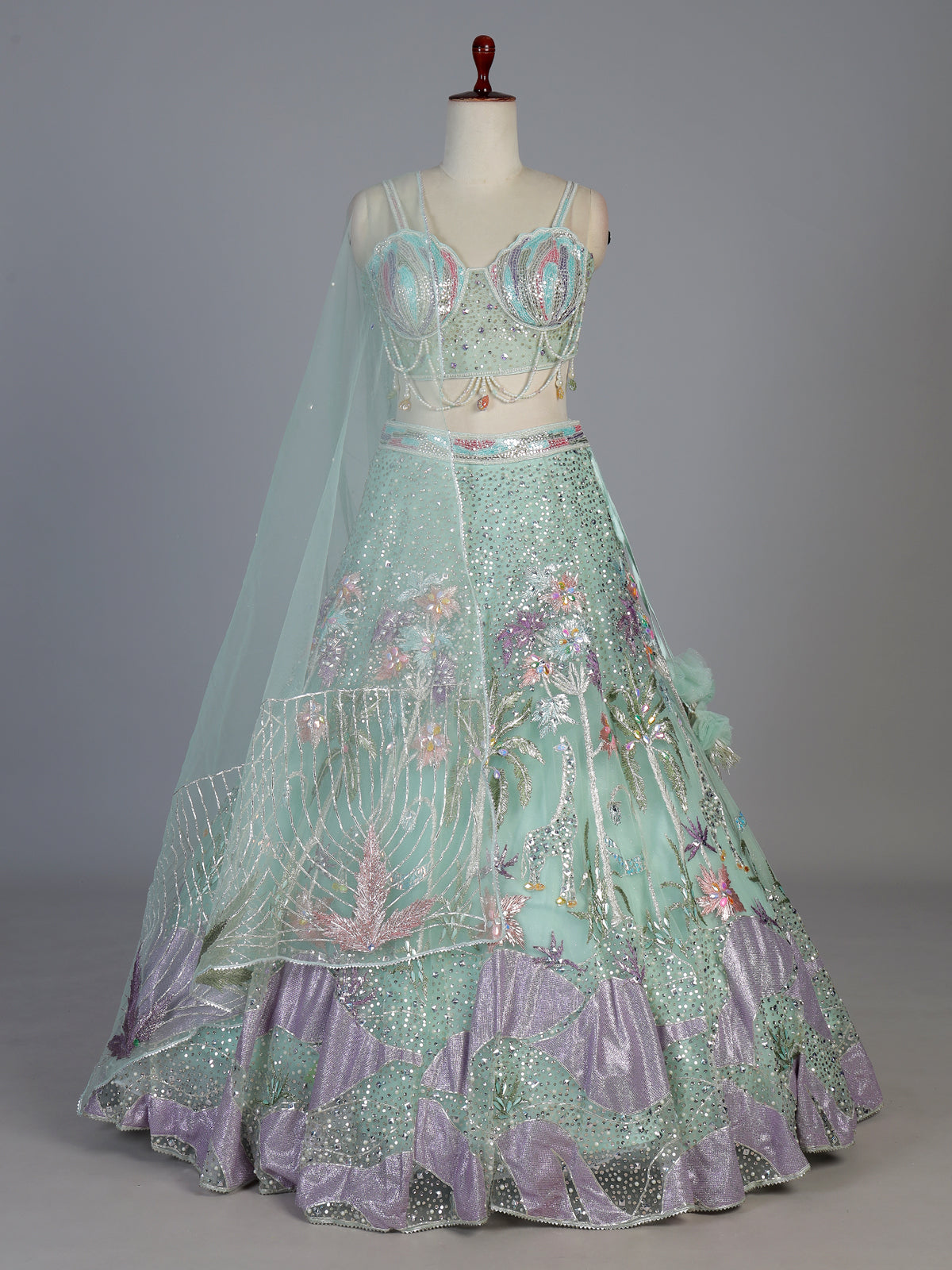 Pista net embellished statement lehenga choli
