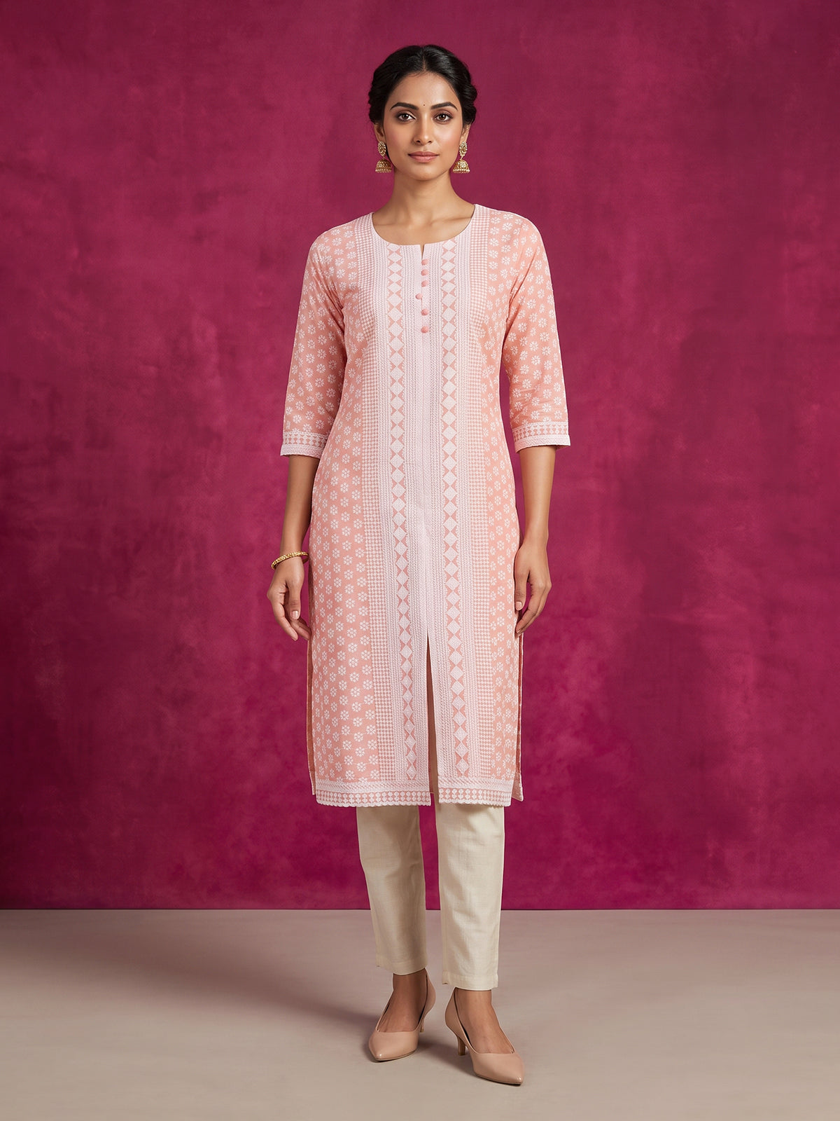 Peach chikan kurti with embroidery and elegant round neckline