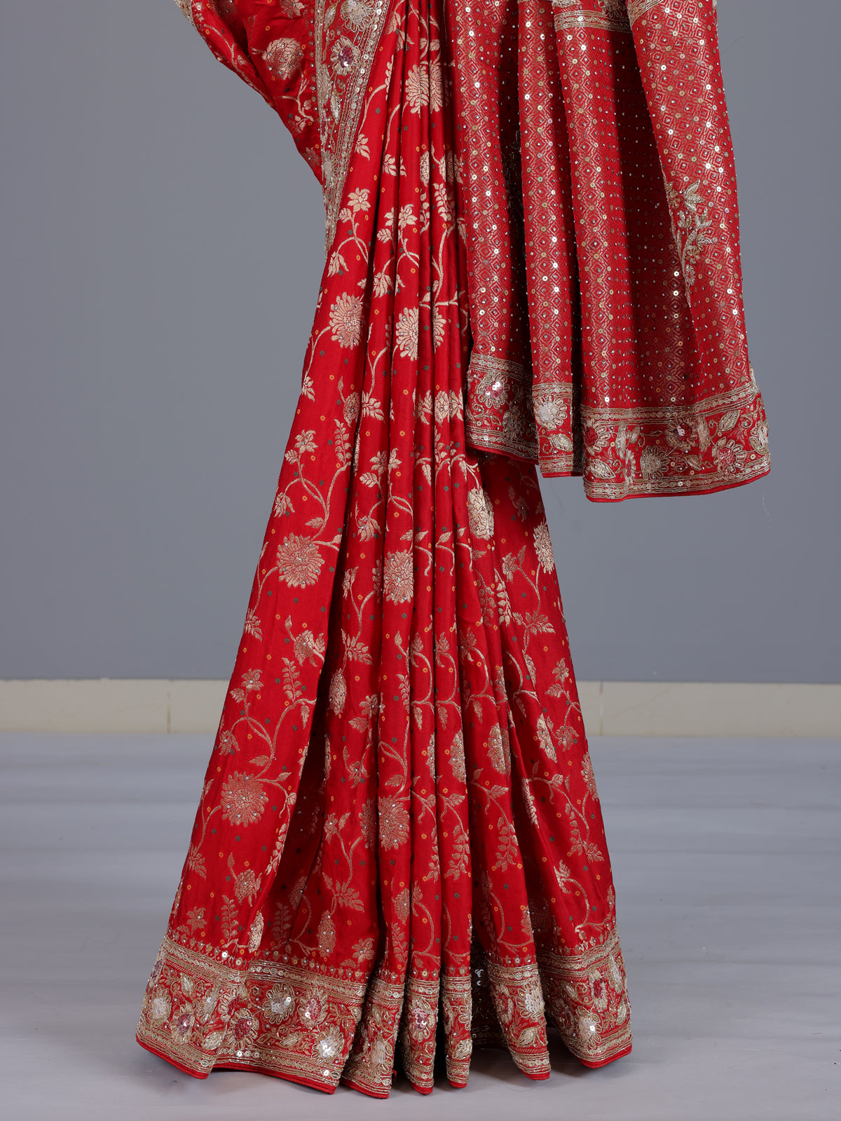 Red dola silk saree with floral zardosi and pearl zari work