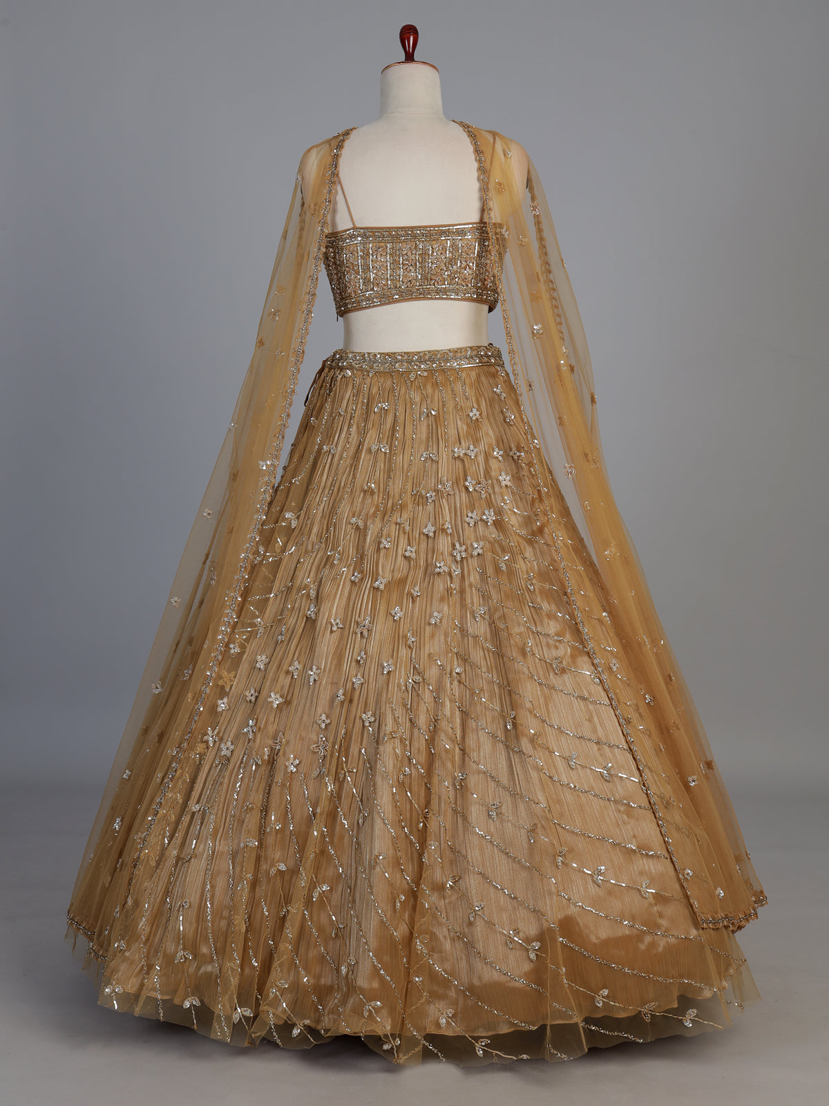 Dark beige net stone embellished festive lehenga choli
