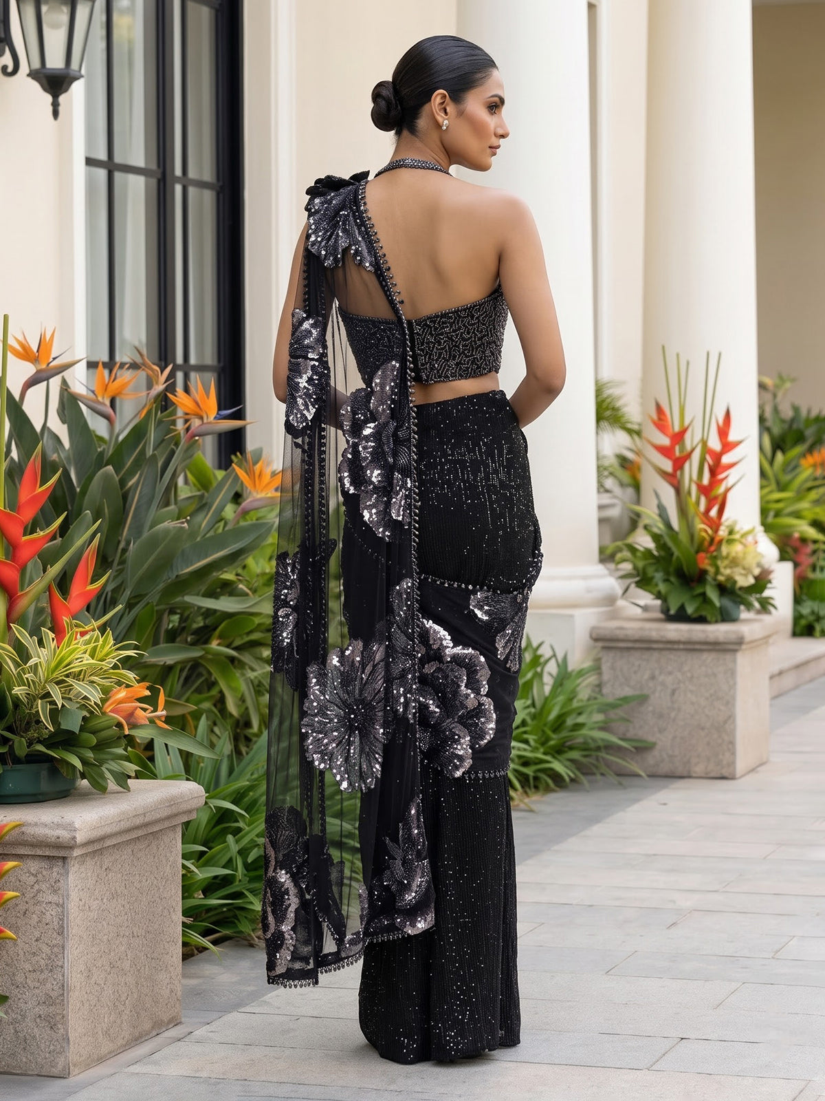 Black sequined net saree with halter blouse