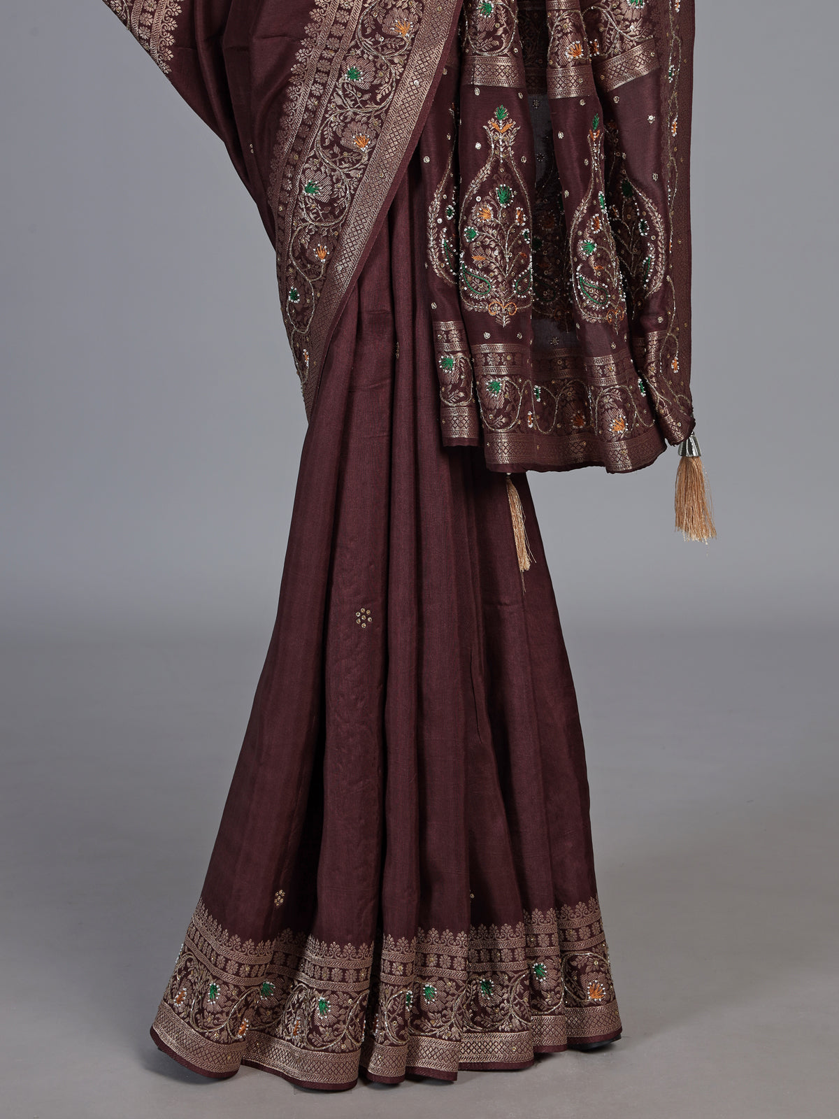 Brown dola silk saree with floral tassel embellished design