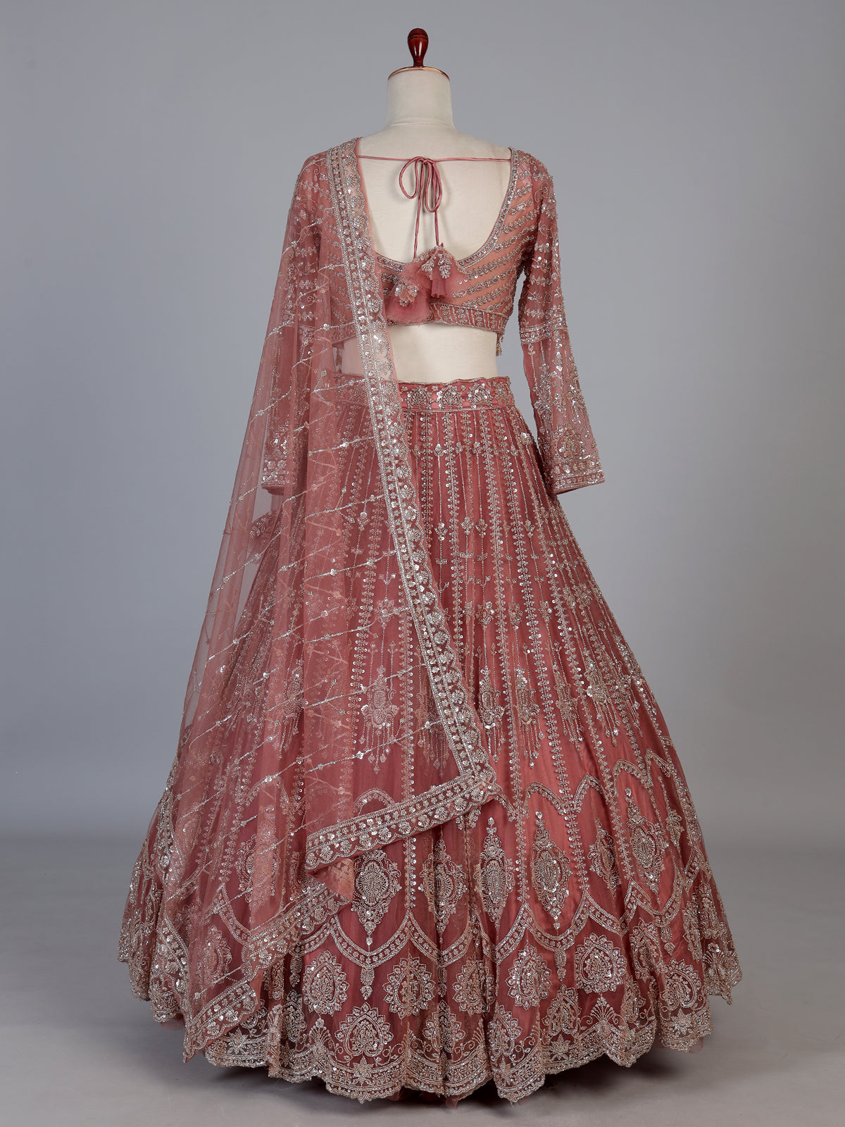 Peach designer net lehenga choli with graceful dupatta