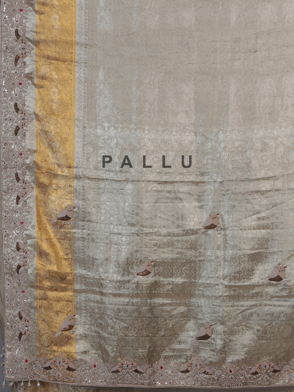 Pastel beige tissue silk saree with bird motif