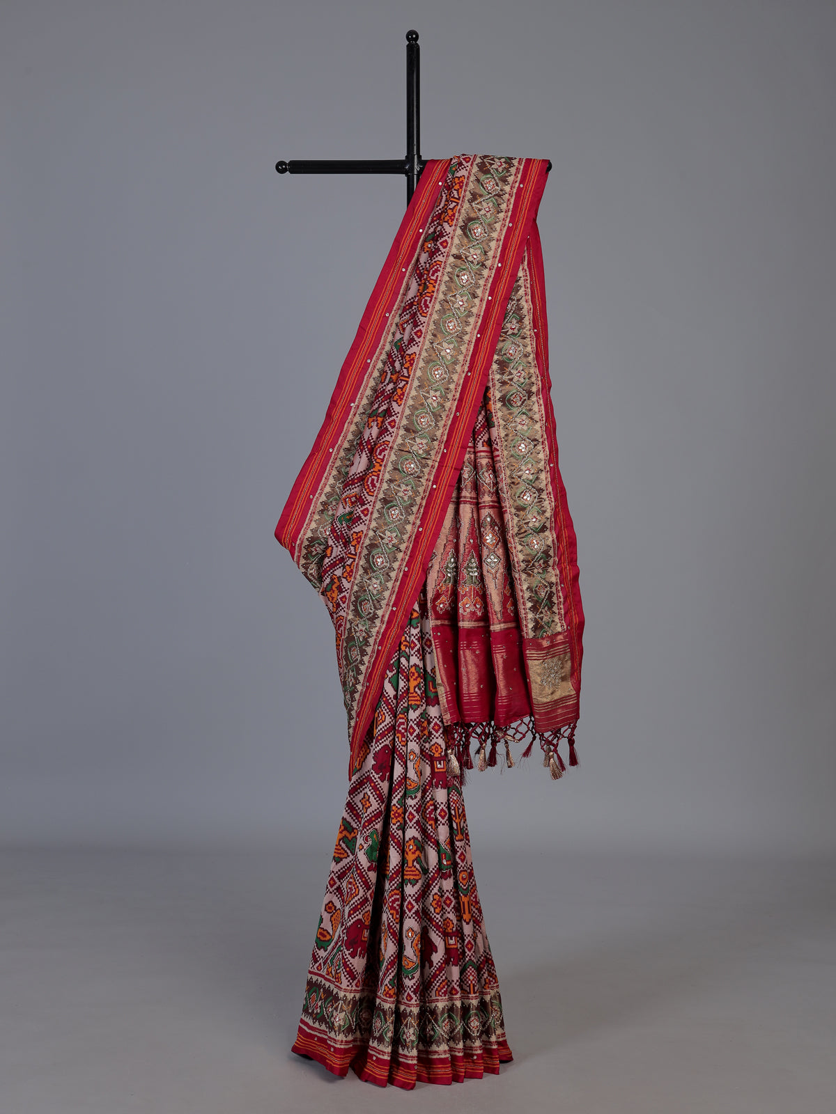 Red art patola silk saree with exquisite handcrafted embellishments