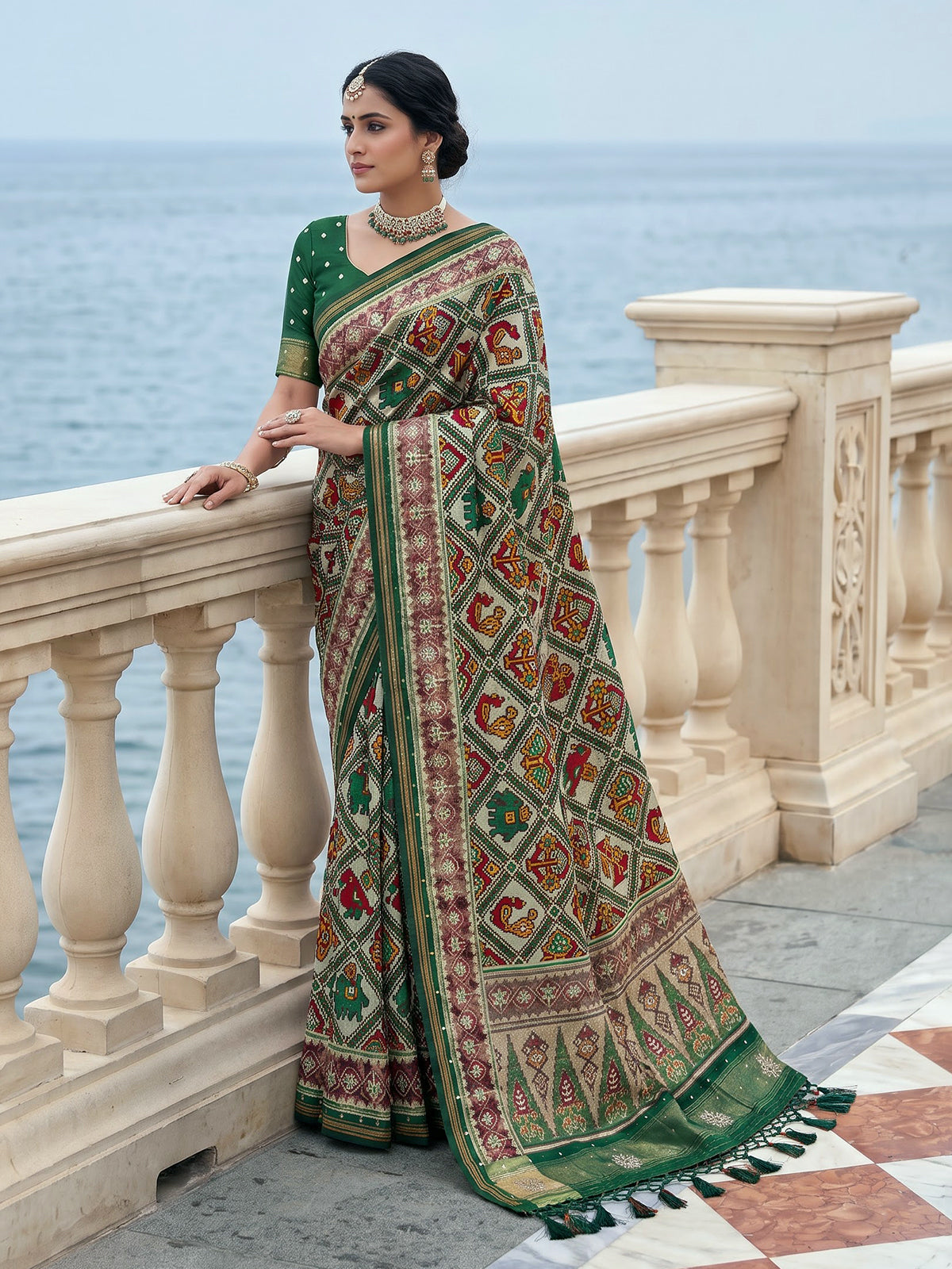Green art patola silk saree with rich zardosi handwork