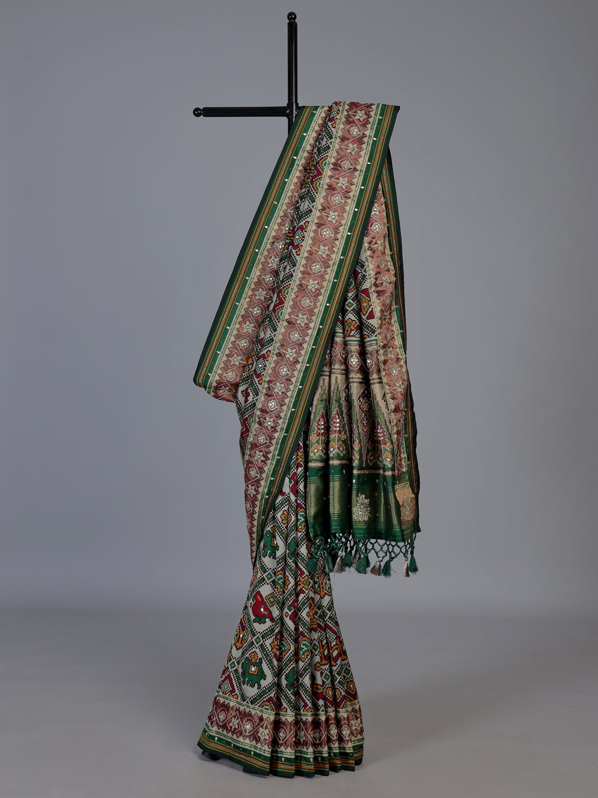 Green art patola silk saree with rich zardosi handwork