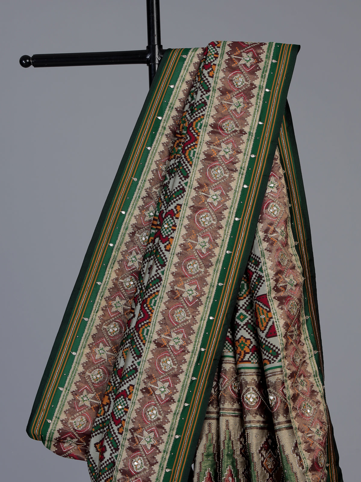 Green art patola silk saree with rich zardosi handwork