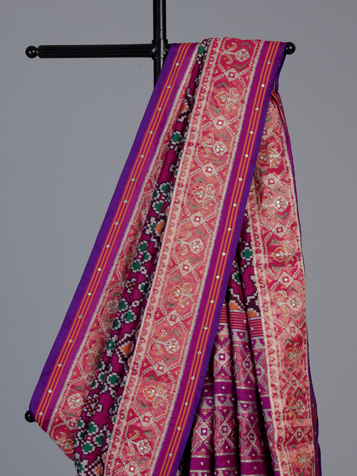 Magenta art patola silk saree with stone embellished elegance