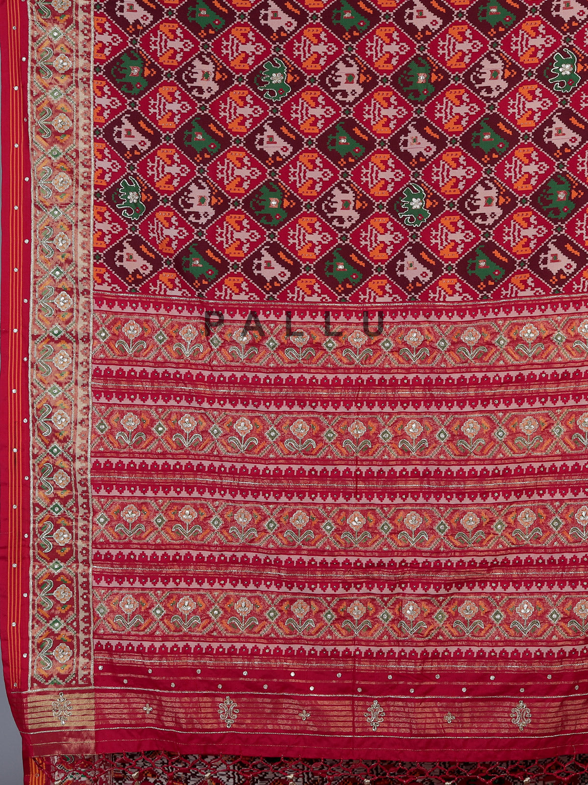 Red art patola silk saree with elegant stone work