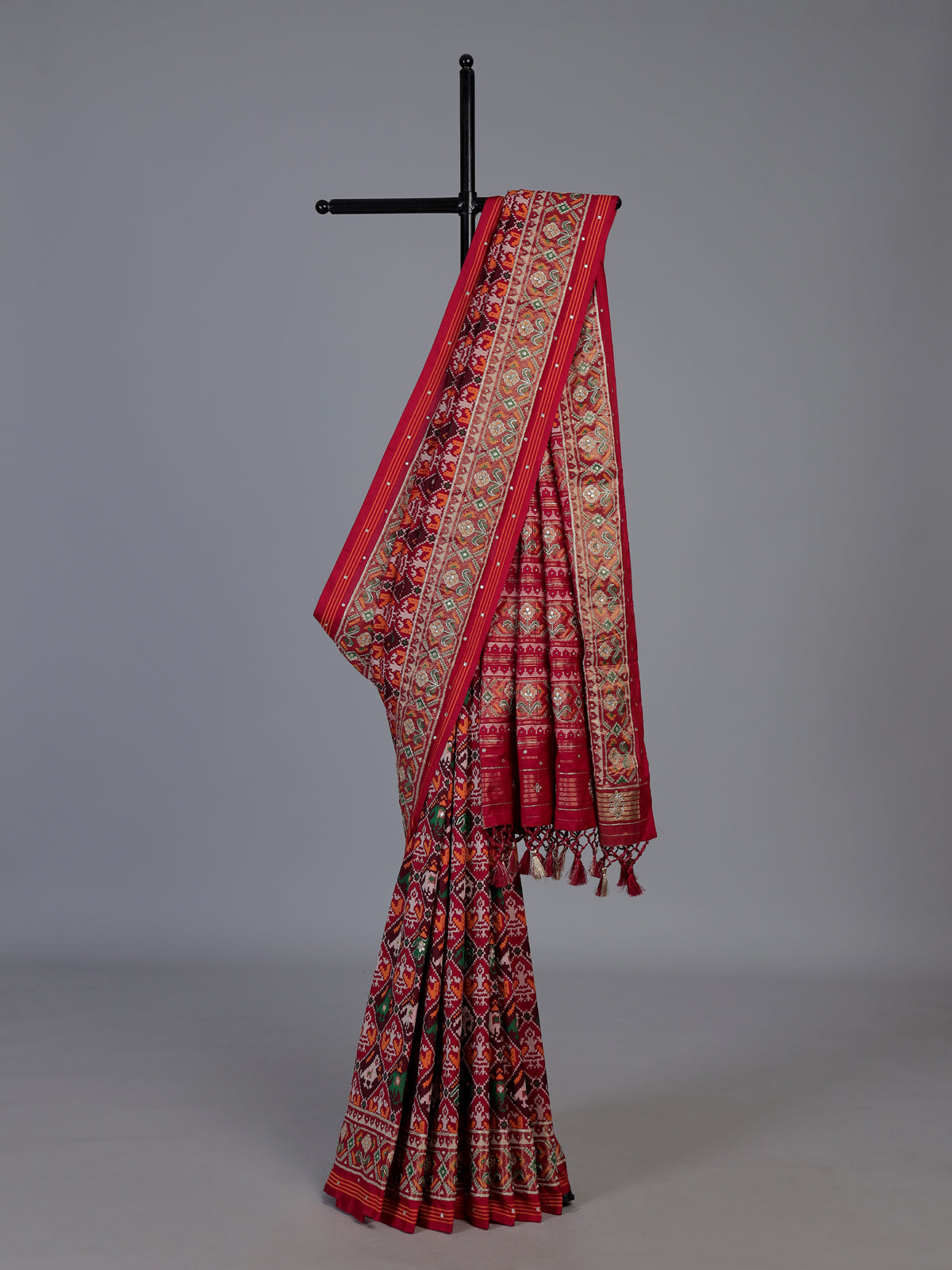 Red art patola silk saree with elegant stone work