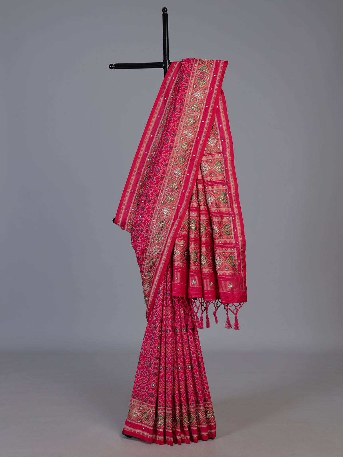 Rani pink art patola silk saree with rich stone work