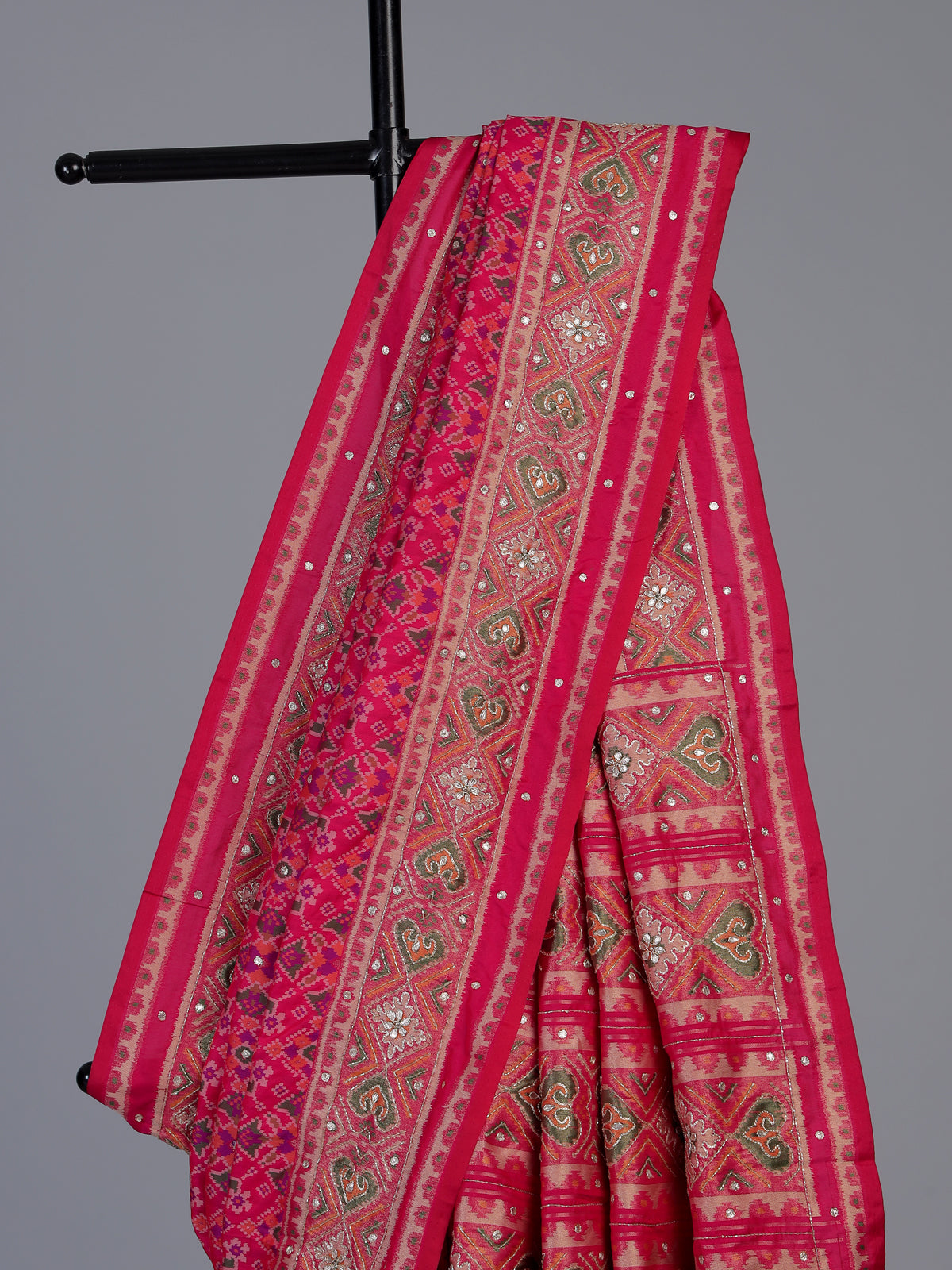 Rani pink art patola silk saree with rich stone work